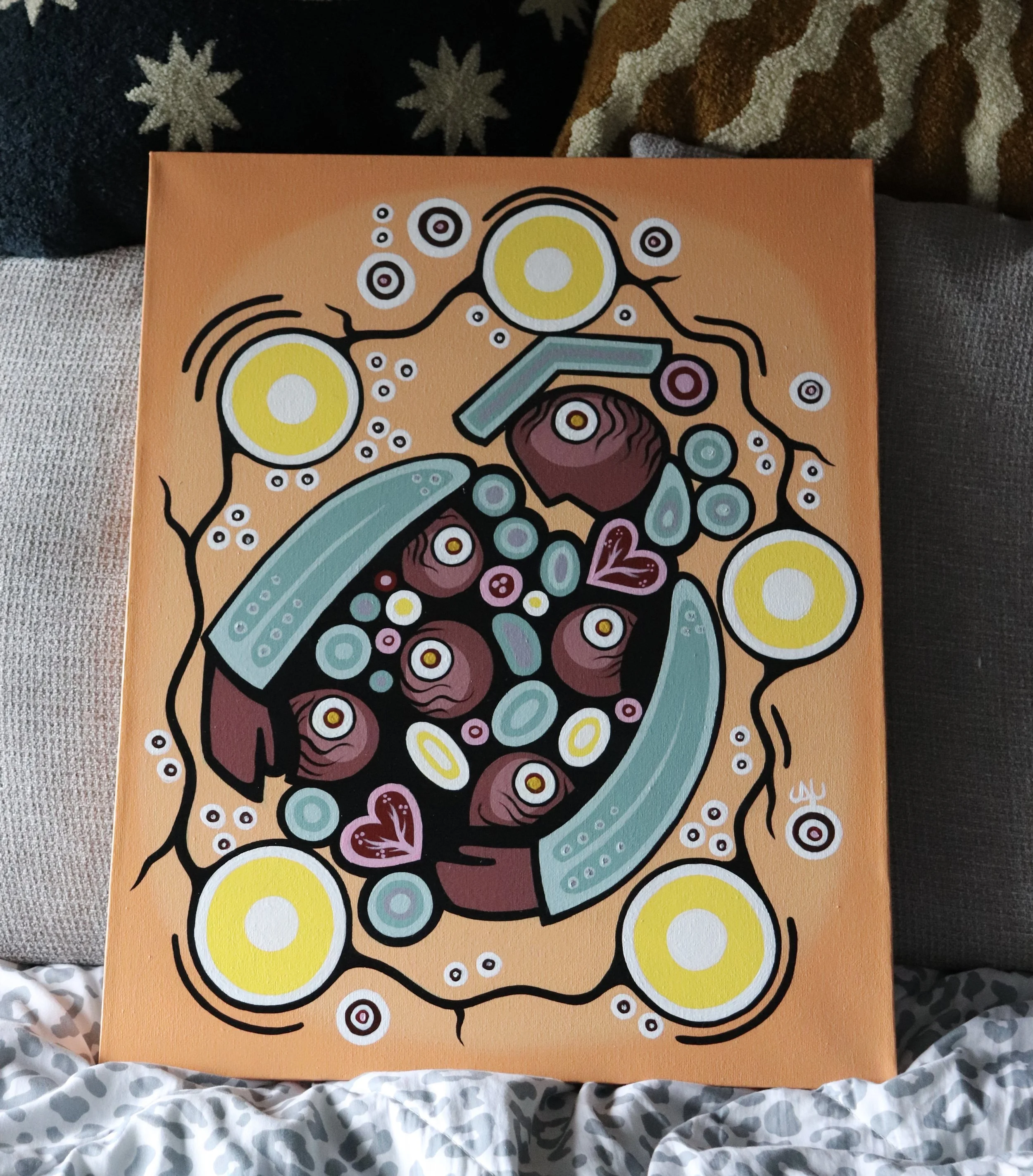Colorful abstract artwork with bold lines and bright colors including yellow, teal, maroon, and white, featuring circular and linear elements on an orange background.