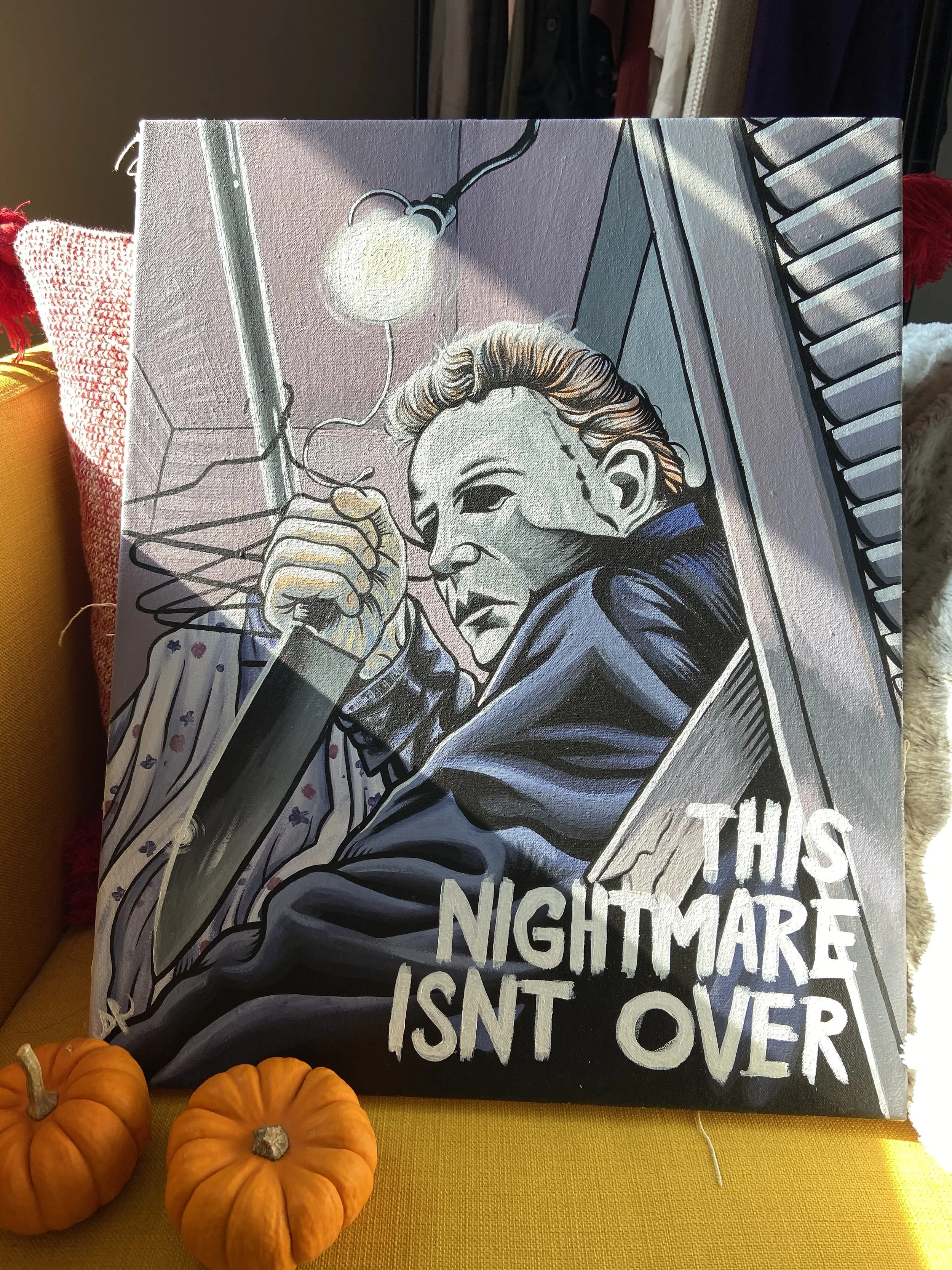 A Halloween-themed illustration featuring a sinister-looking woman with short blonde hair, wearing dark clothing, holding a knife, and looking menacing. The illustration includes part of a house or building in the background. The text on the illustra