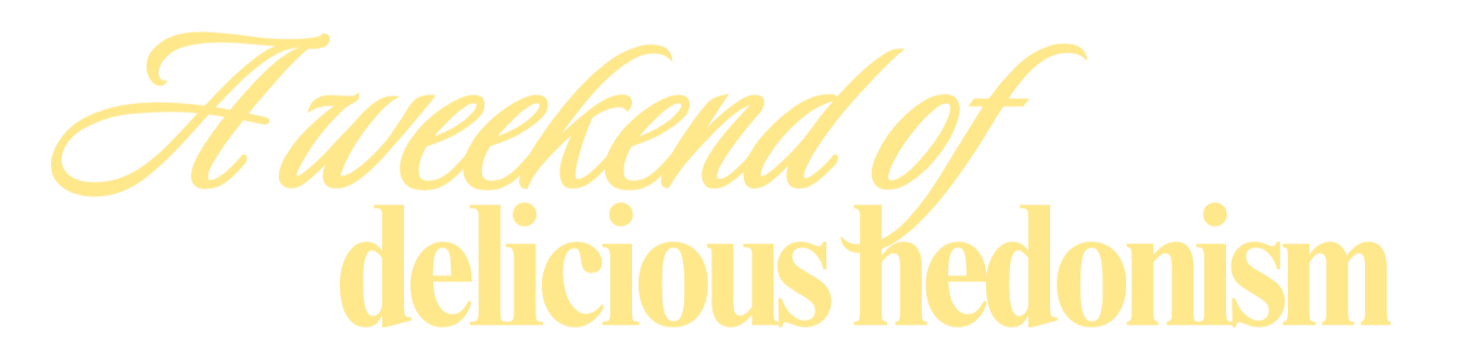 Text reading "A weekend of delicious hedonism" in a scripted font on a black background.
