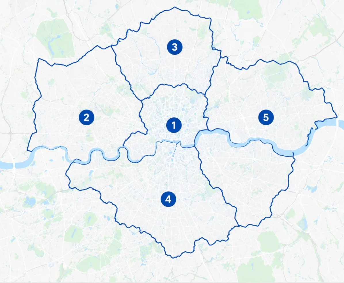 Map of a city divided into five numbered districts with blue boundary lines, a river running through the city, and a white background with faint geographical features.