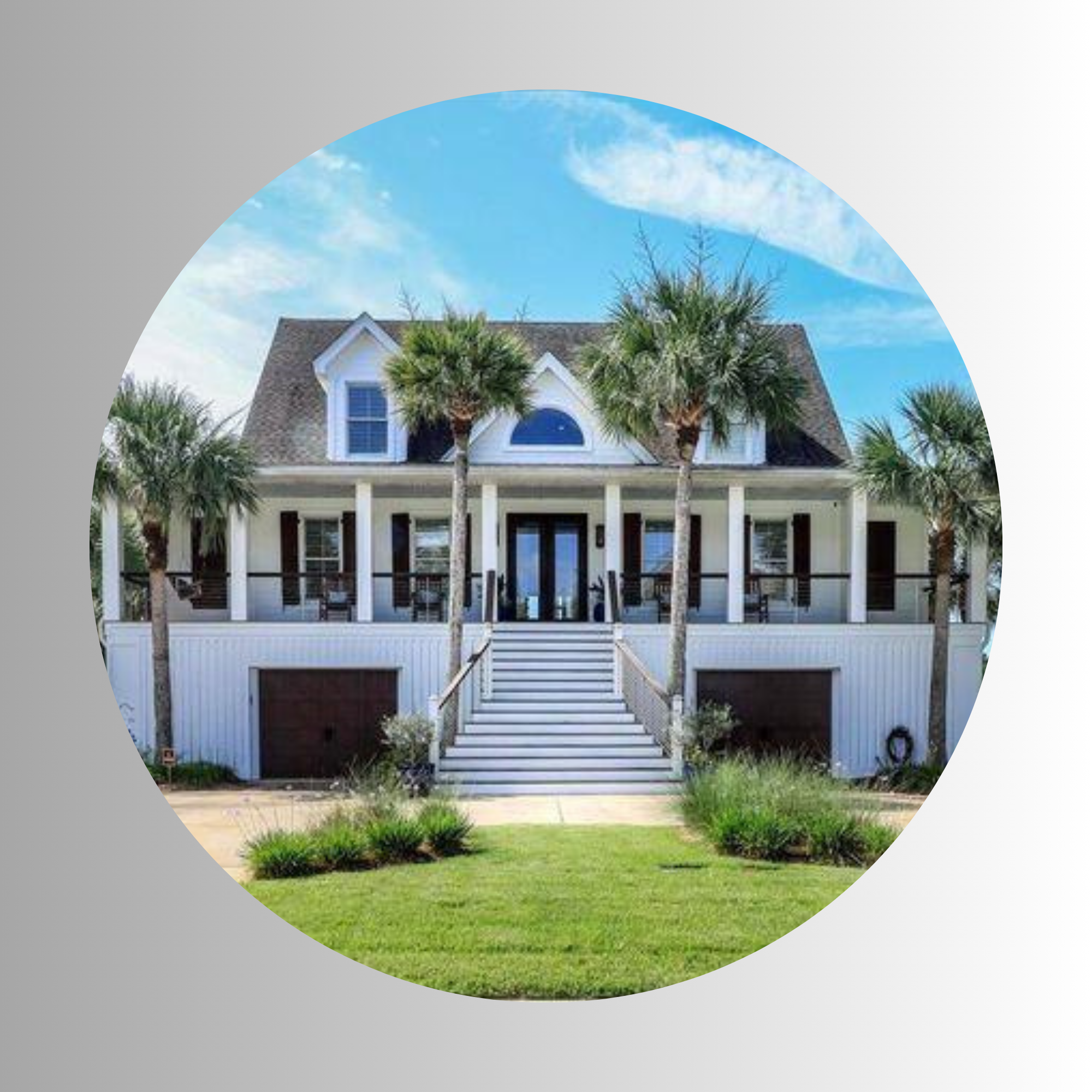 A house with a steep roof, front porch, surrounded by palm trees and a grassy lawn, under a partly cloudy blue sky.
