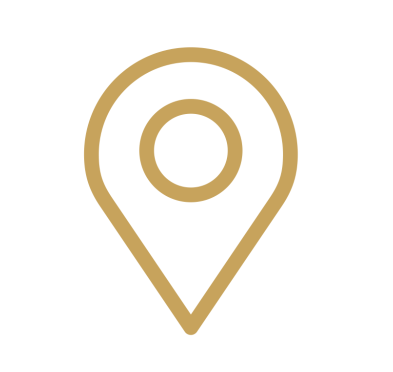 A gold location pin icon on a black background.