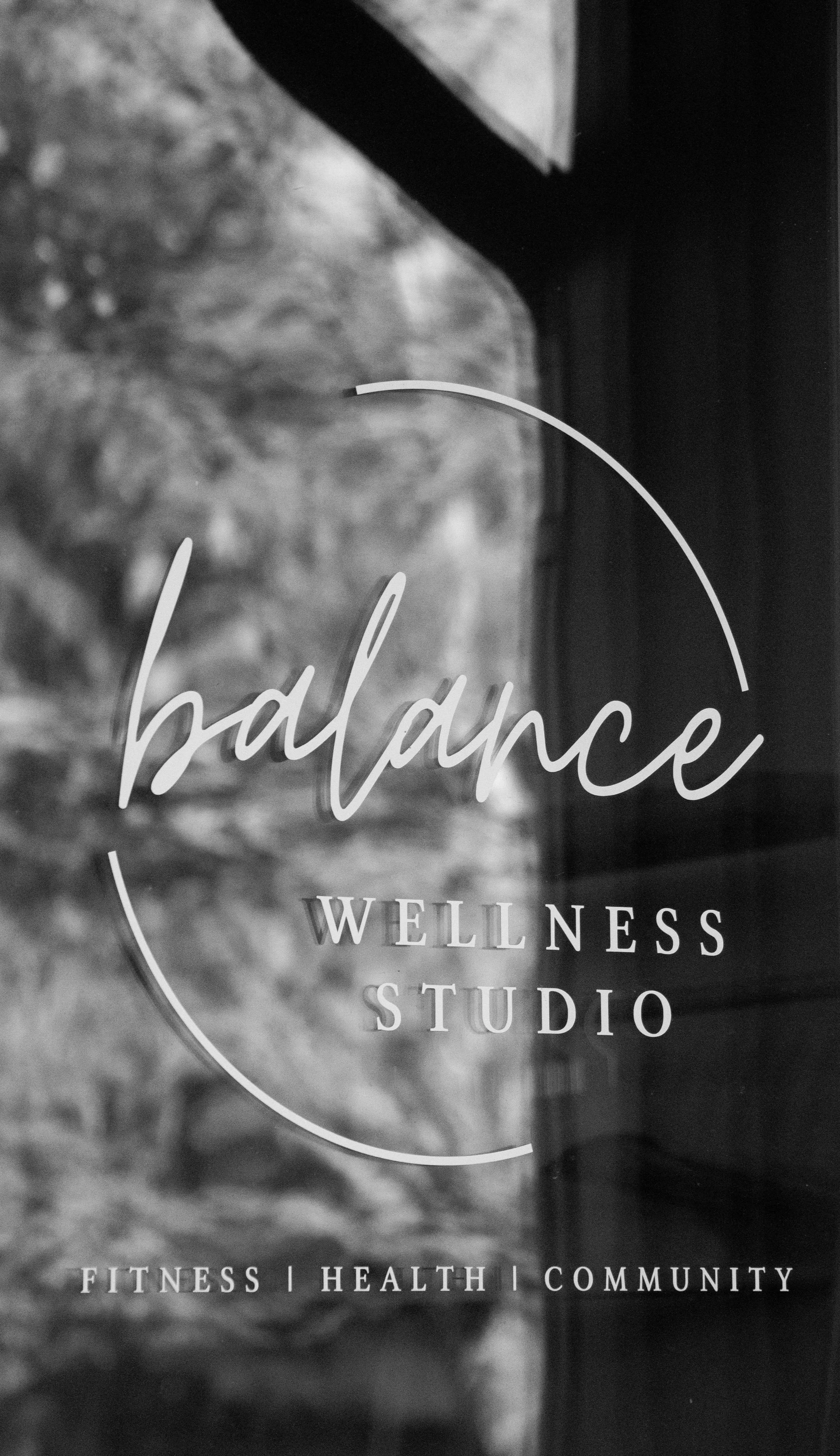 Sign for Balance Wellness Studio, focusing on fitness, health, and community.