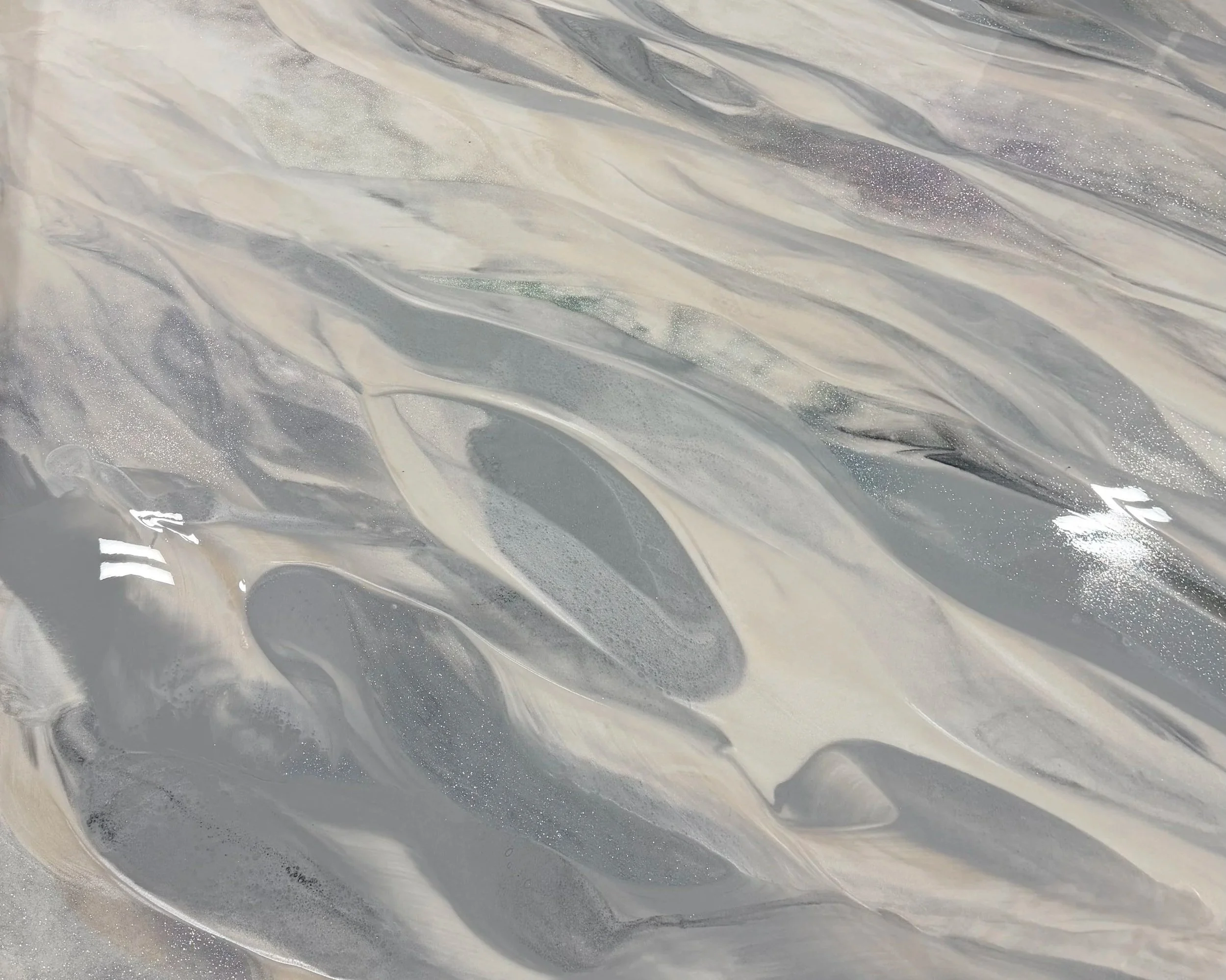 Marbled Metallic Epoxy with shades of gray, black, white, and subtle glittery accents.