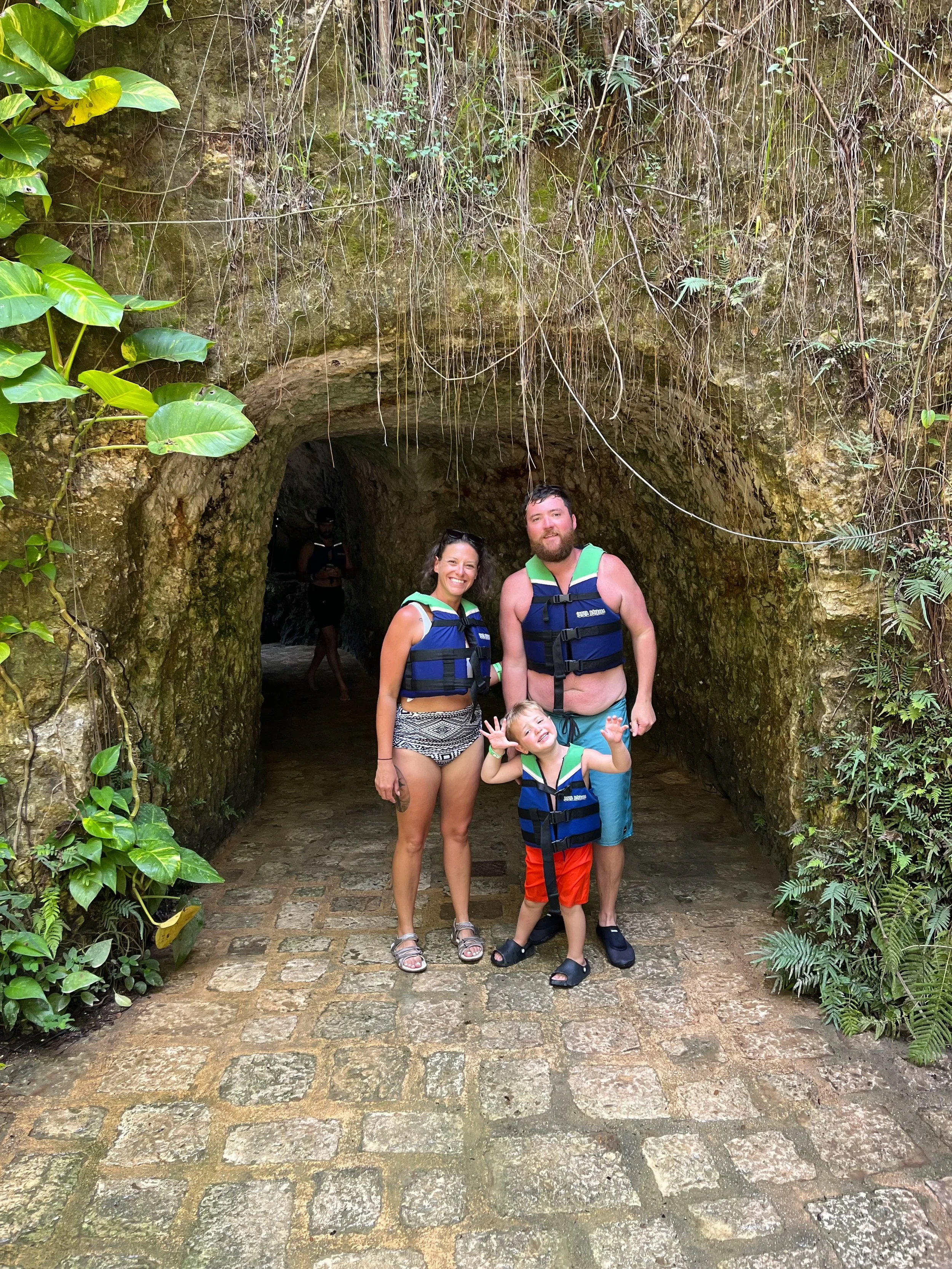 Family visiting a cenote during a private shore excursion from Progreso, Yucatán