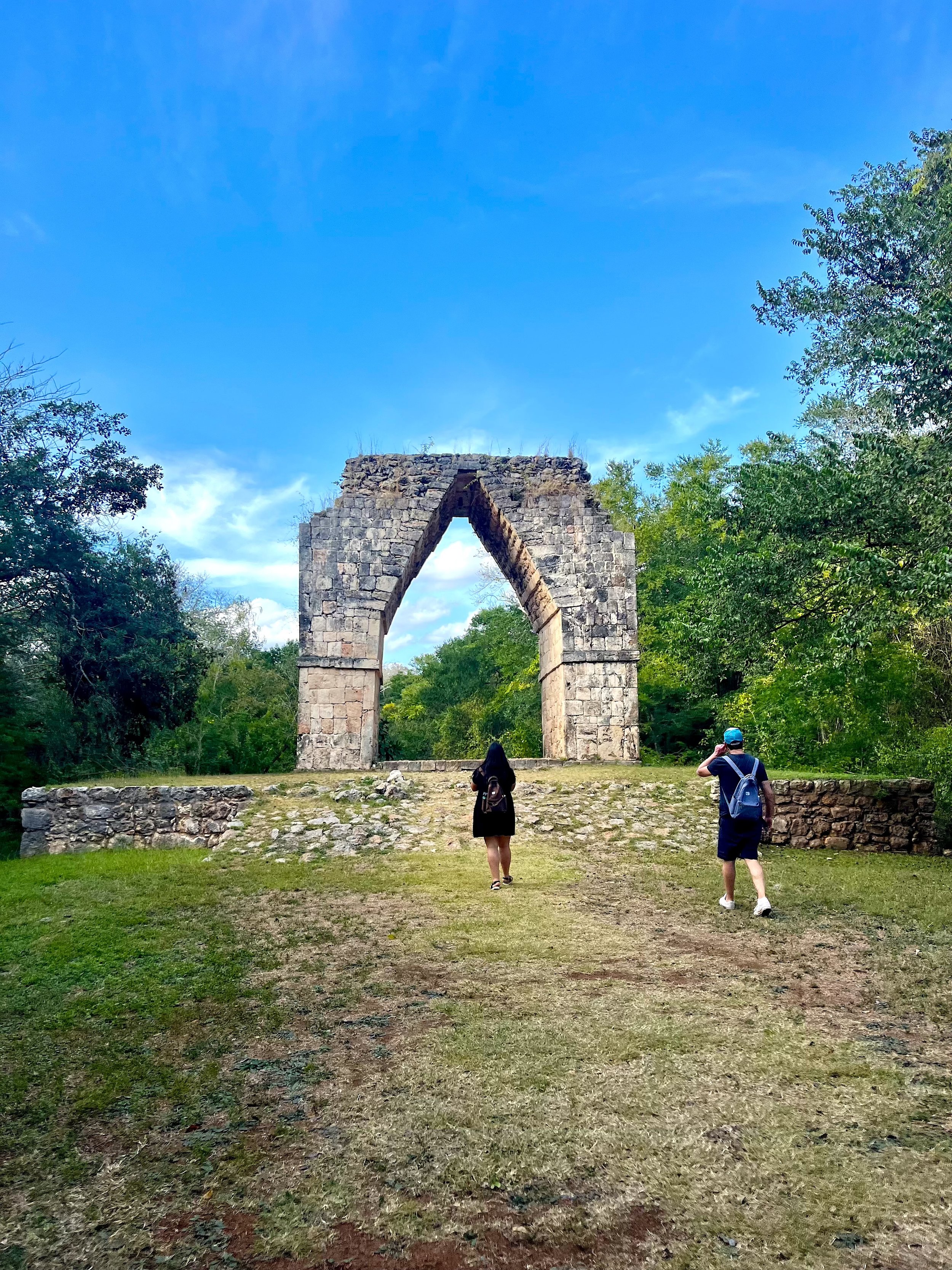 Visitors exploring Kabah archaeological site during a private Puuc Route tour in Yucatán