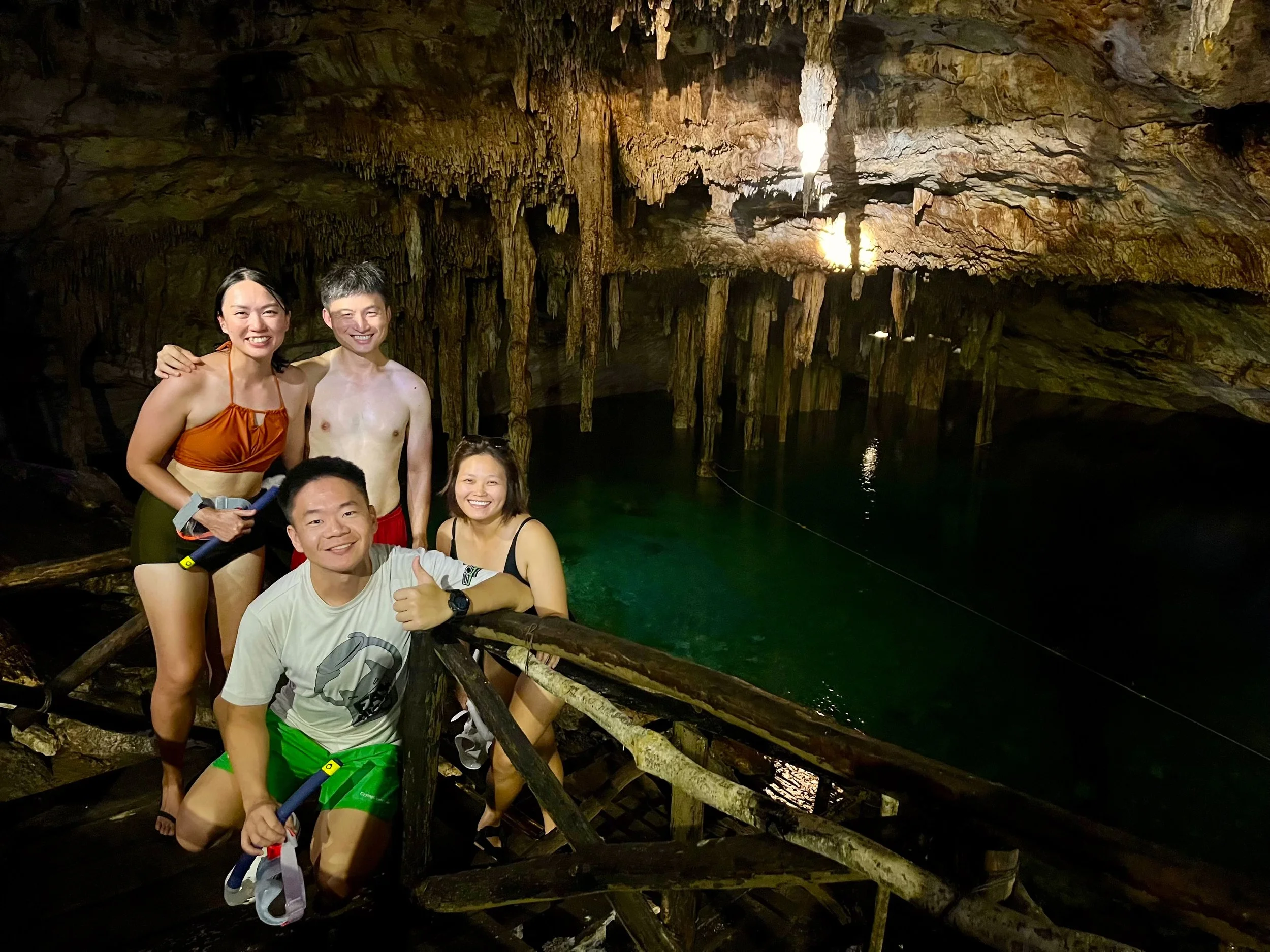 Guests exploring a cave cenote during a private cenote tour from Mérida, Yucatán