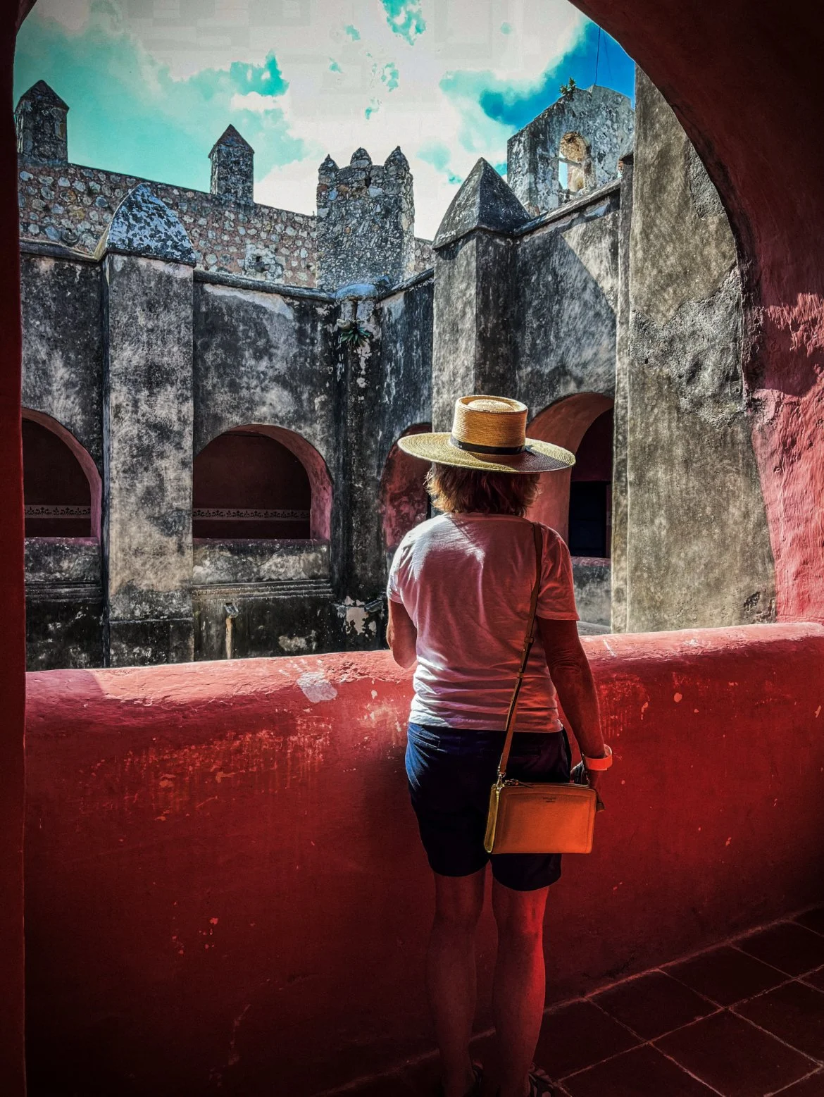 Traveler exploring the San Bernardino de Siena Convent in Valladolid, Yucatán, Mexico.