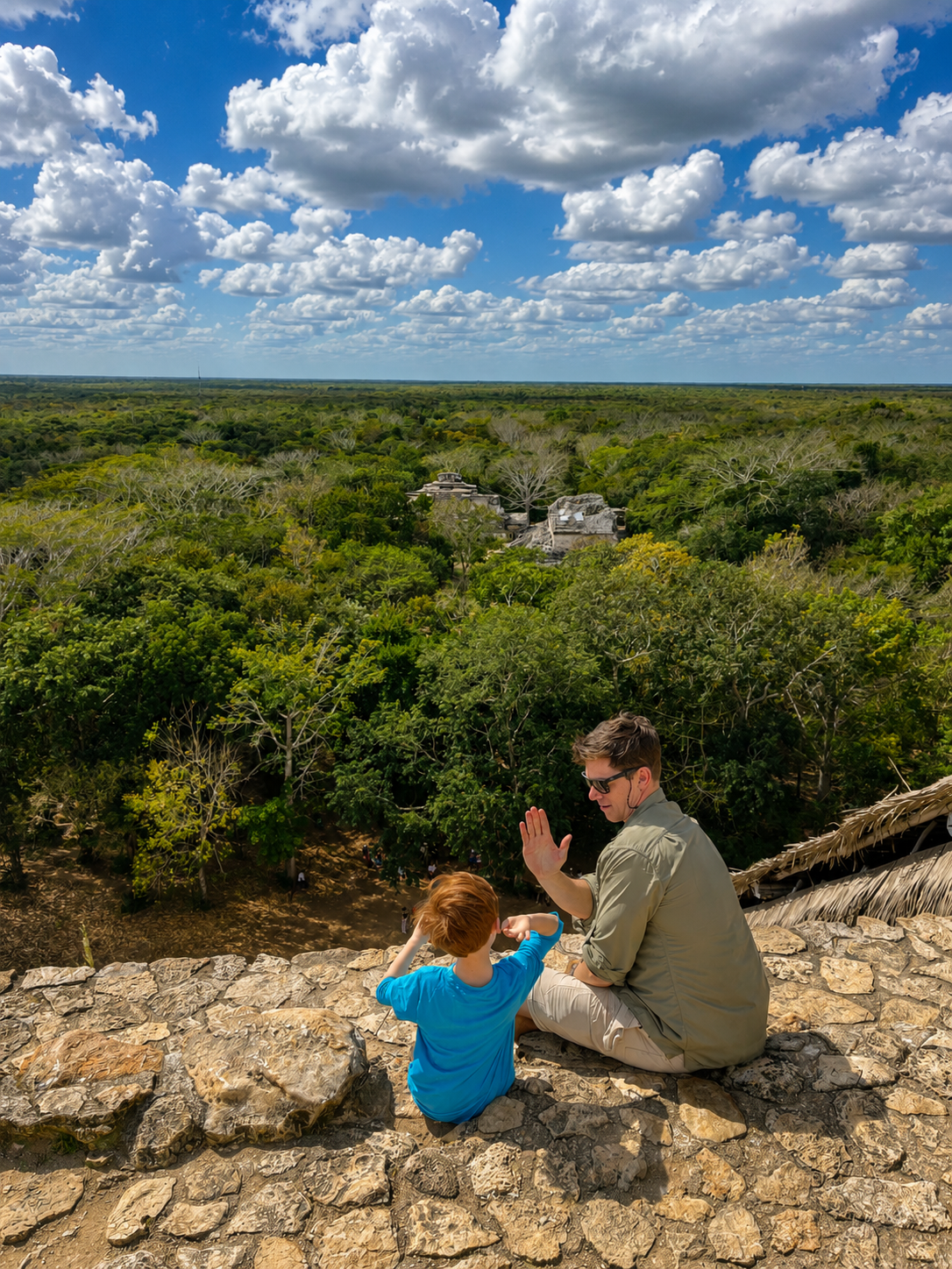 Visitors enjoying the panoramic view from the Acropolis at Ek Balam archaeological site in Yucatán, Mexico.