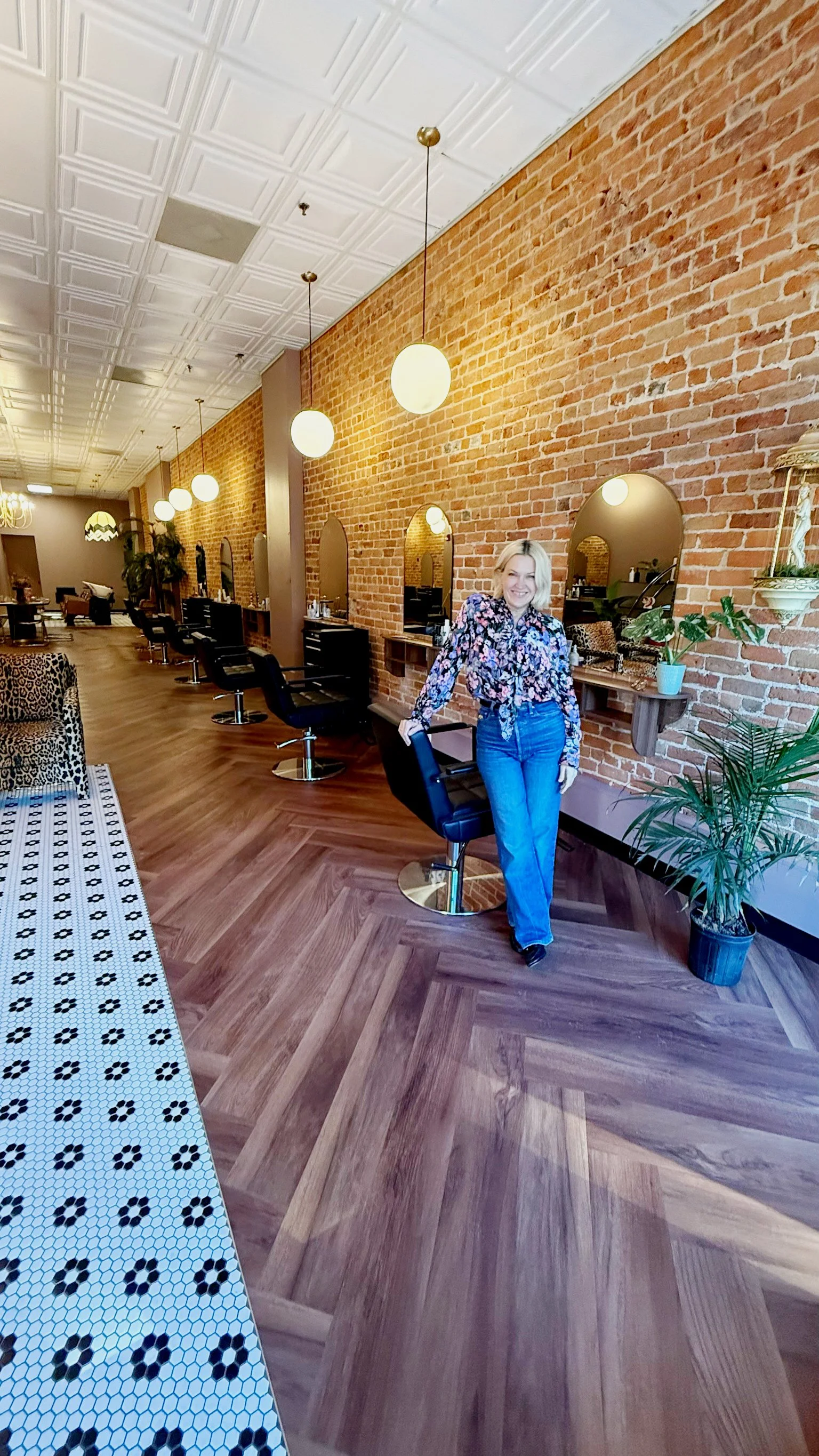 Rachel Radford, owner of The Darling Salon, standing in the salon in Downtown Durham