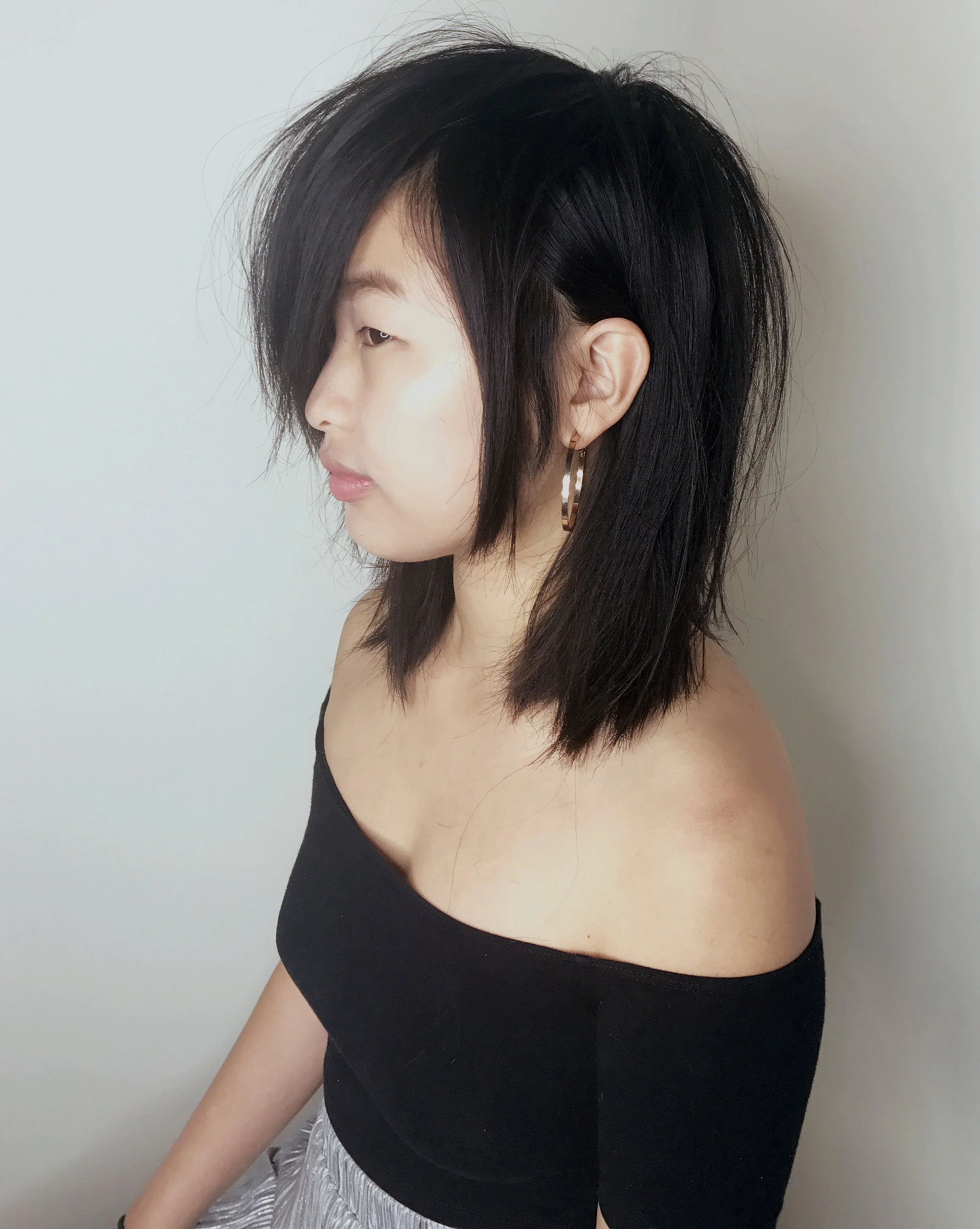 Textured razor cut with face framing layers on black hair at The Darling Salon in Durham