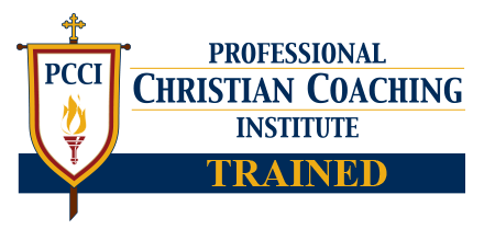 Logo of the Professional Christian Coaching Institute with a shield bearing a cross, flame, and torch, and the words 'Trained' in yellow.