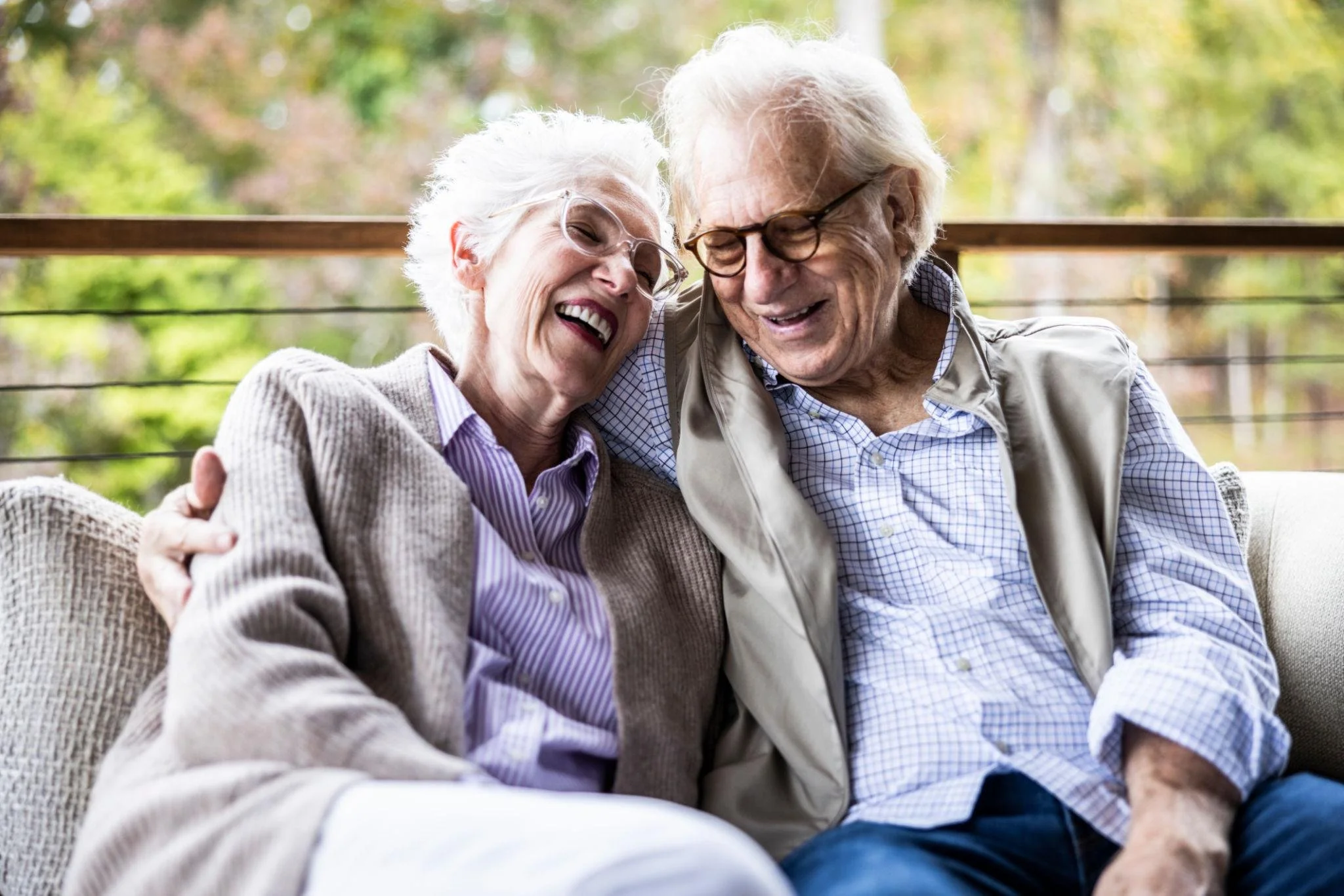 seniors embracing on porch.jpeg