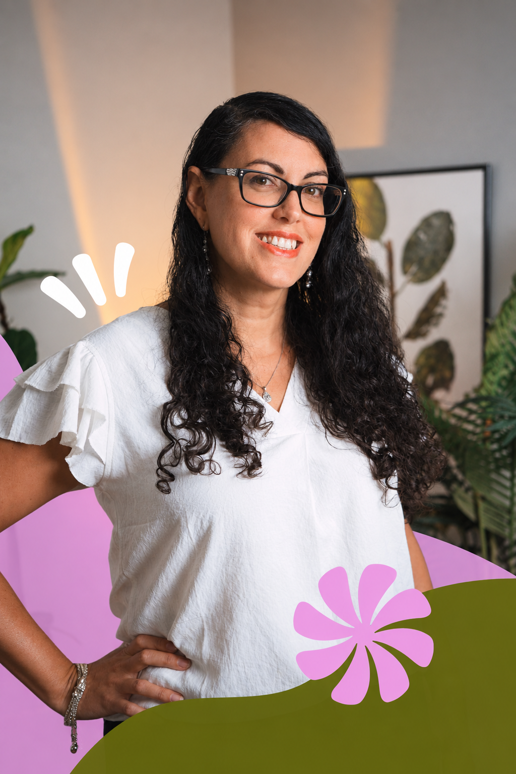 A woman with long curly dark hair, glasses, and wearing a white top with ruffled sleeves, poses with her hand on her hip. She is smiling and standing in a room with plants and framed botanical art. Digital flower illustrations are added around her and at the bottom of the image.
