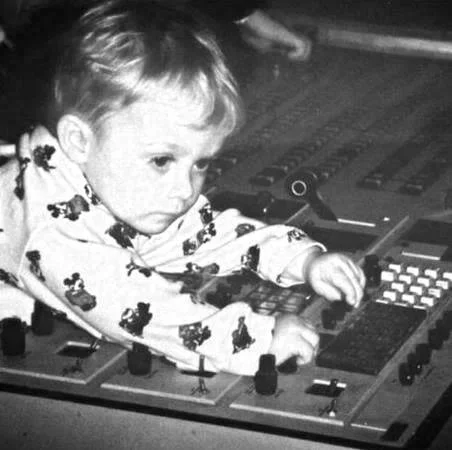 James Lutz as a child working a broadcast mixing console