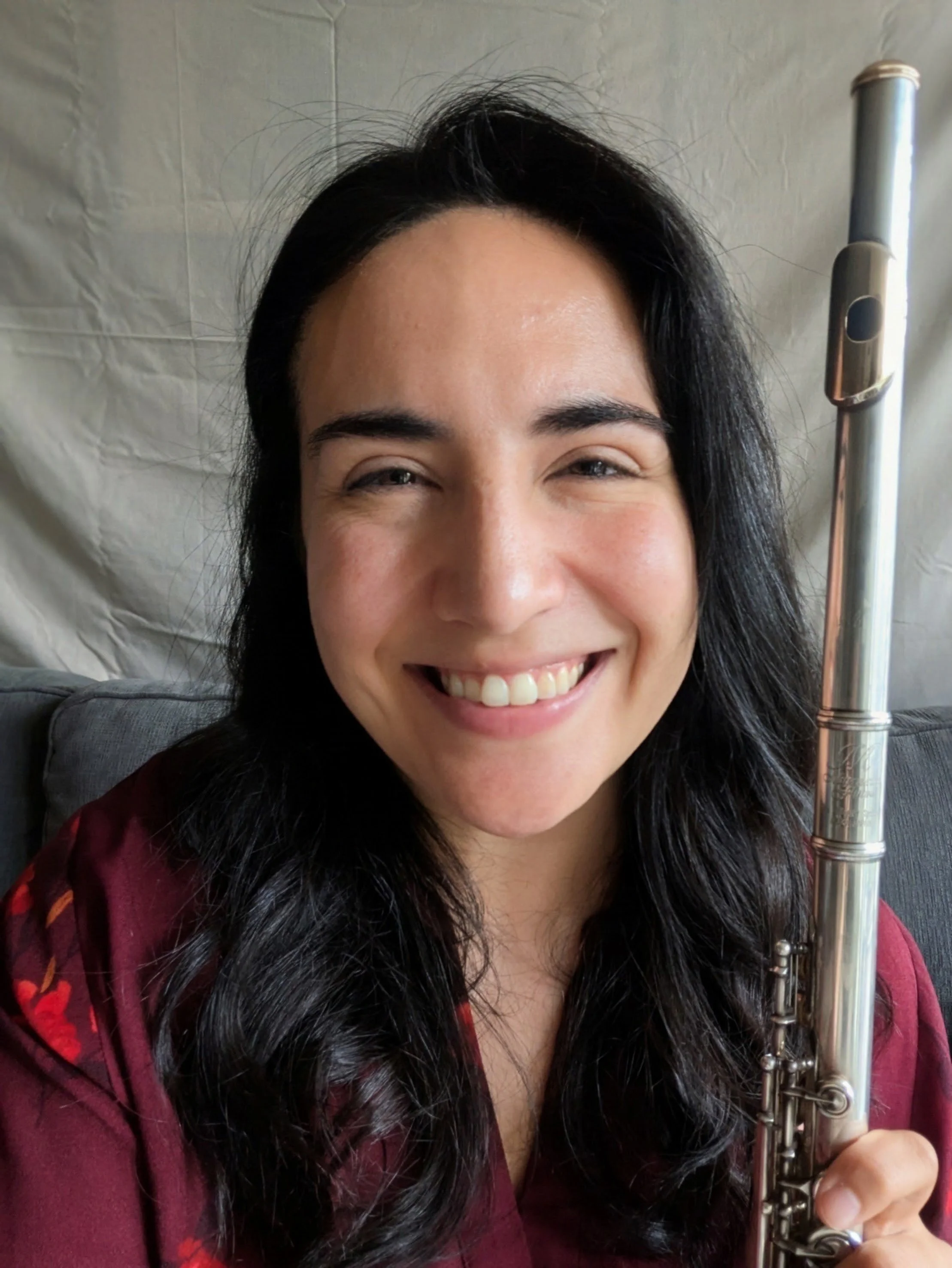 An image of Michelle Scroggie who is available to teach flute lessons online to beginner, intermediate, and advanced flute students.