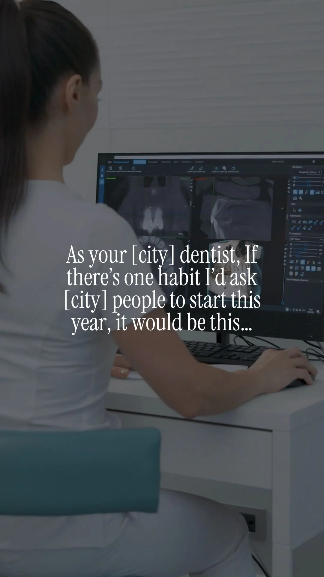 A female dentist seated at a desk viewing dental radiographs on a dual monitor computer screen in a modern dental office.