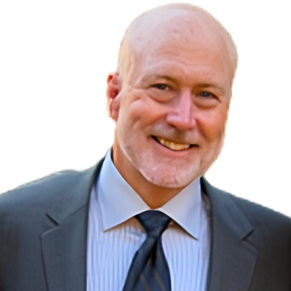Smiling man with short gray hair, wearing a suit and tie.