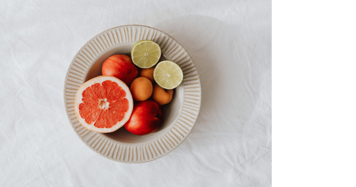 bowl with grapefruit, limes, nectarines, and apricots