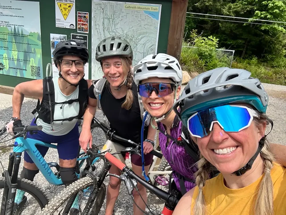 Dr. Marci Nelson mountain biking with friends at Galbraith Mountain Trails