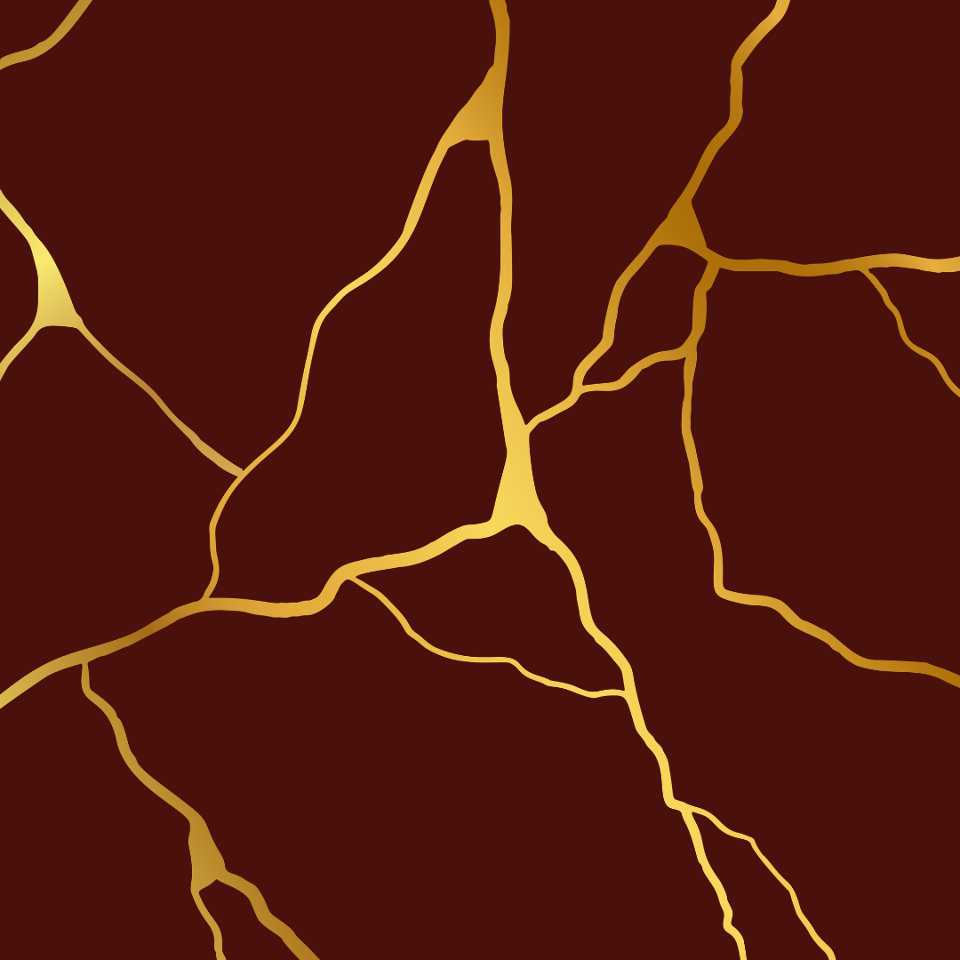 Close-up of a maroon background with golden cracks to represent the art of Kintsugi