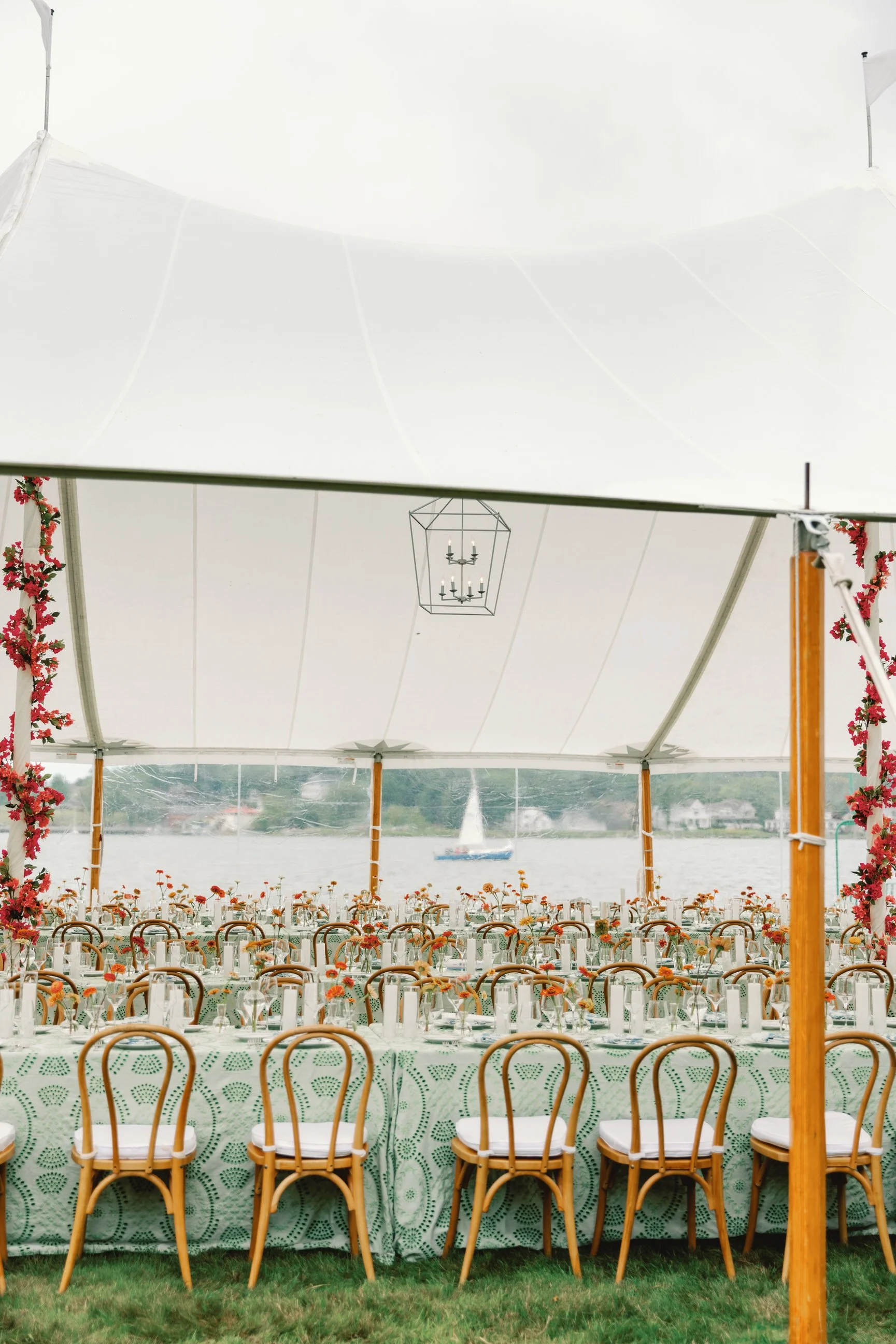 Waterfront view with layered details and garden-inspired blooms for this lake macatawa wedding
