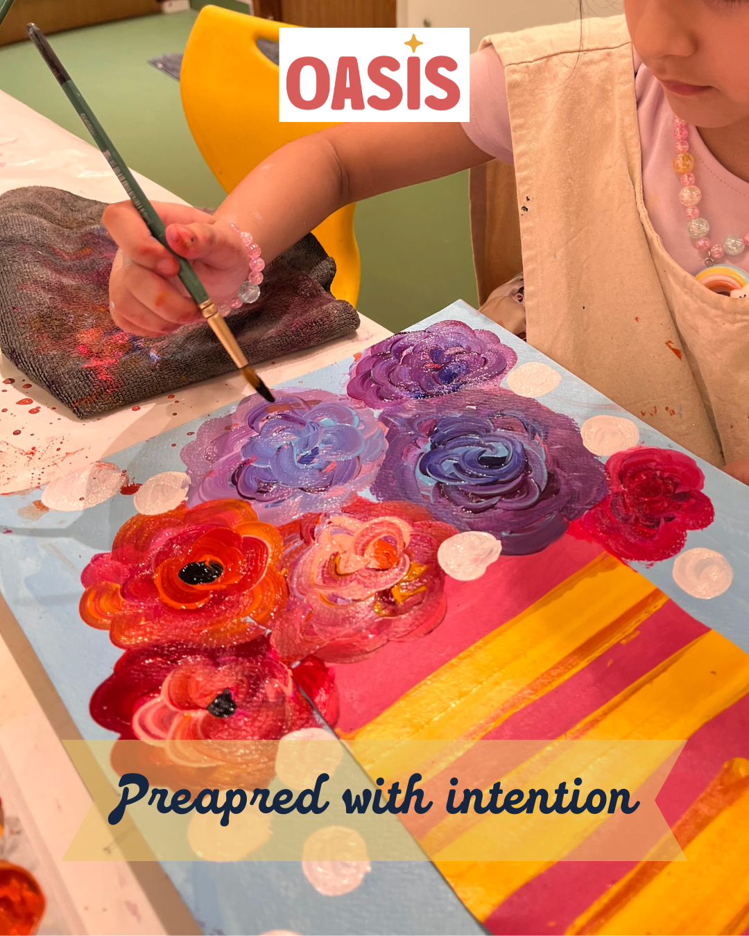 A child painting colorful roses on a canvas with the word 'OASIS' and the phrase 'Prepaid with intention' superimposed on the image.