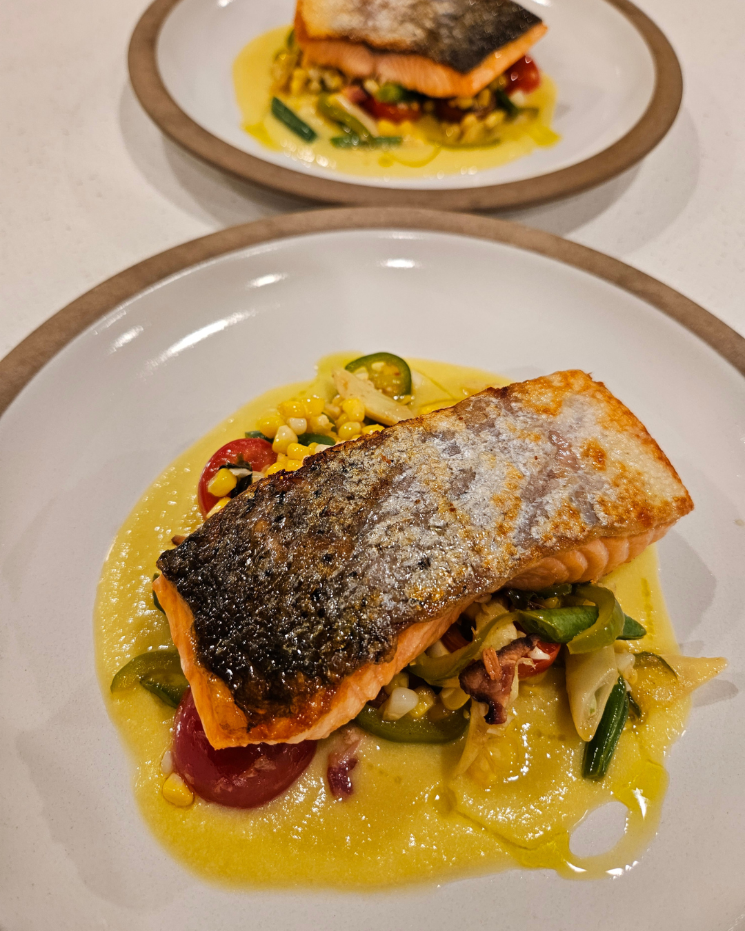 Pan roasted salmon, sweet corn succotash, corn puree, herbs