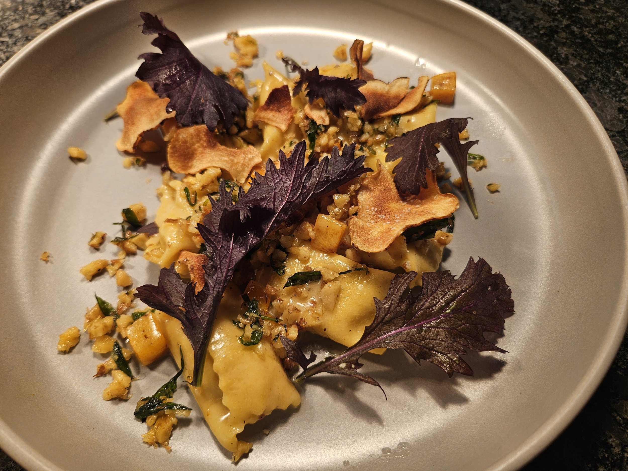 Sunchoke agnolotti with hazelnuts and mizuna