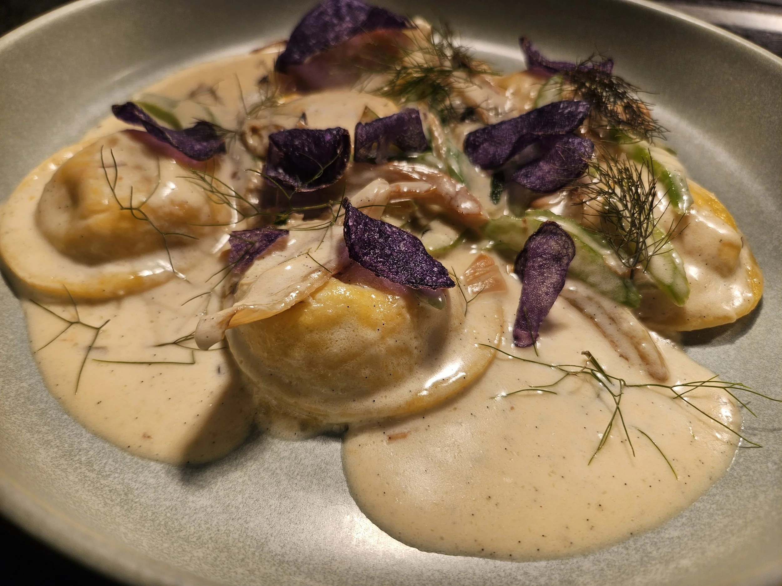 Lobster ravioli with roasted fennel, potato, and vanilla cream sauce