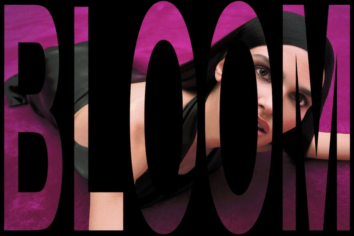 A woman with black hair, makeup, and red lipstick lying on a purple surface, with the word 'BOOM' in large black letters overlaying the image.