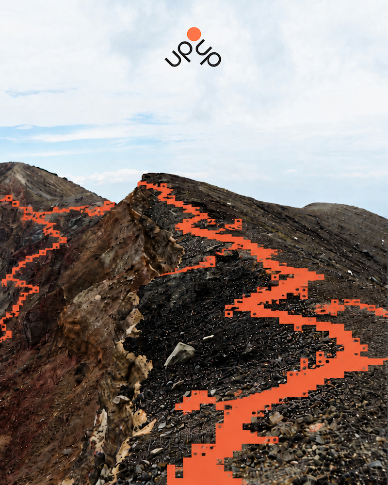 A digitally manipulated landscape photograph of a rocky mountain trail with an orange pixelated trail overlay, and a logo reading 'UP' in black letters with an orange dot above, floating in the cloudy sky.