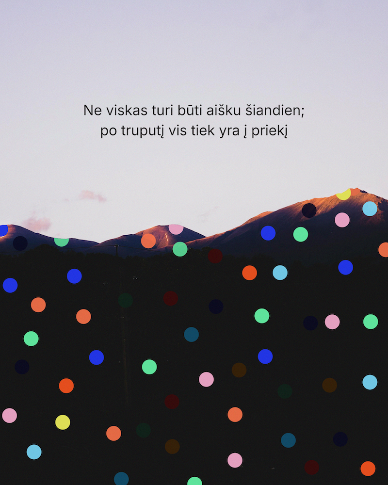 A mountain landscape with a quote in Lithuanian on the sky, overlaid with colorful polka dots on a dark foreground.