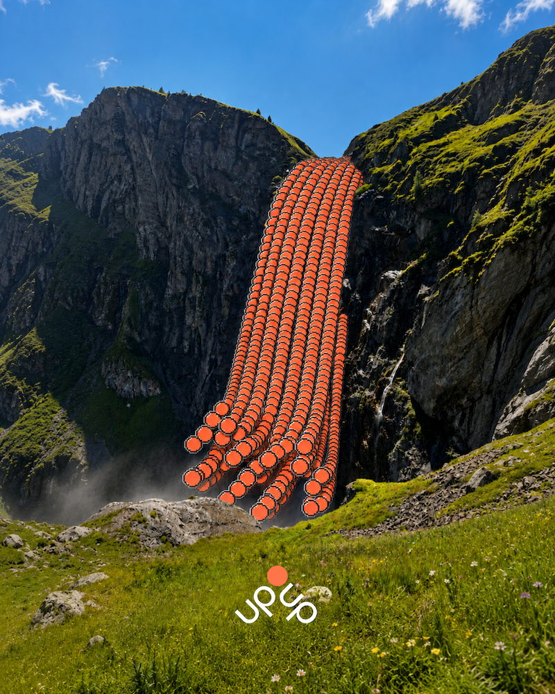 A mountain landscape with a waterfall, grassy foreground, and a digital overlay of orange circular icons cascading down the mountain.