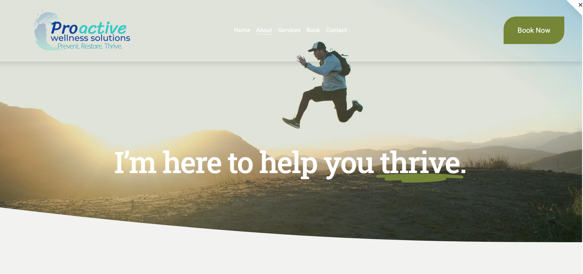 A person jumping in the air on a mountain trail at sunset with mountains in the background, promoting wellness services, for the functional health brand Proactive Wellness Solutions.