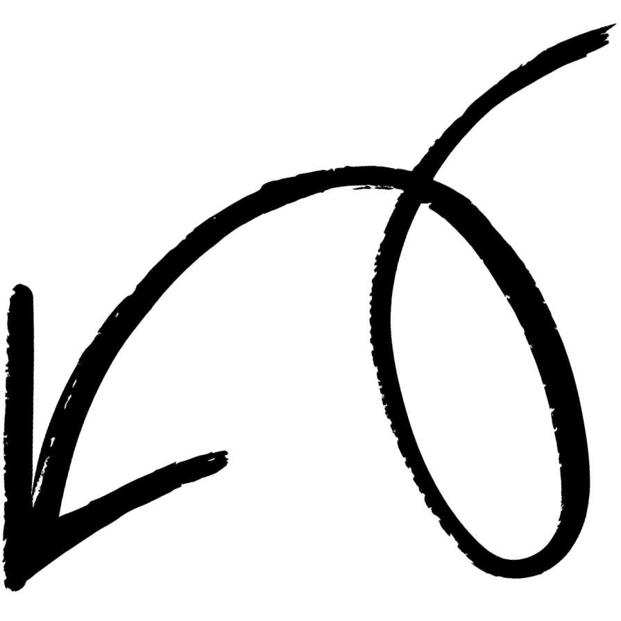Close-up of a handwritten signature on black paper.
