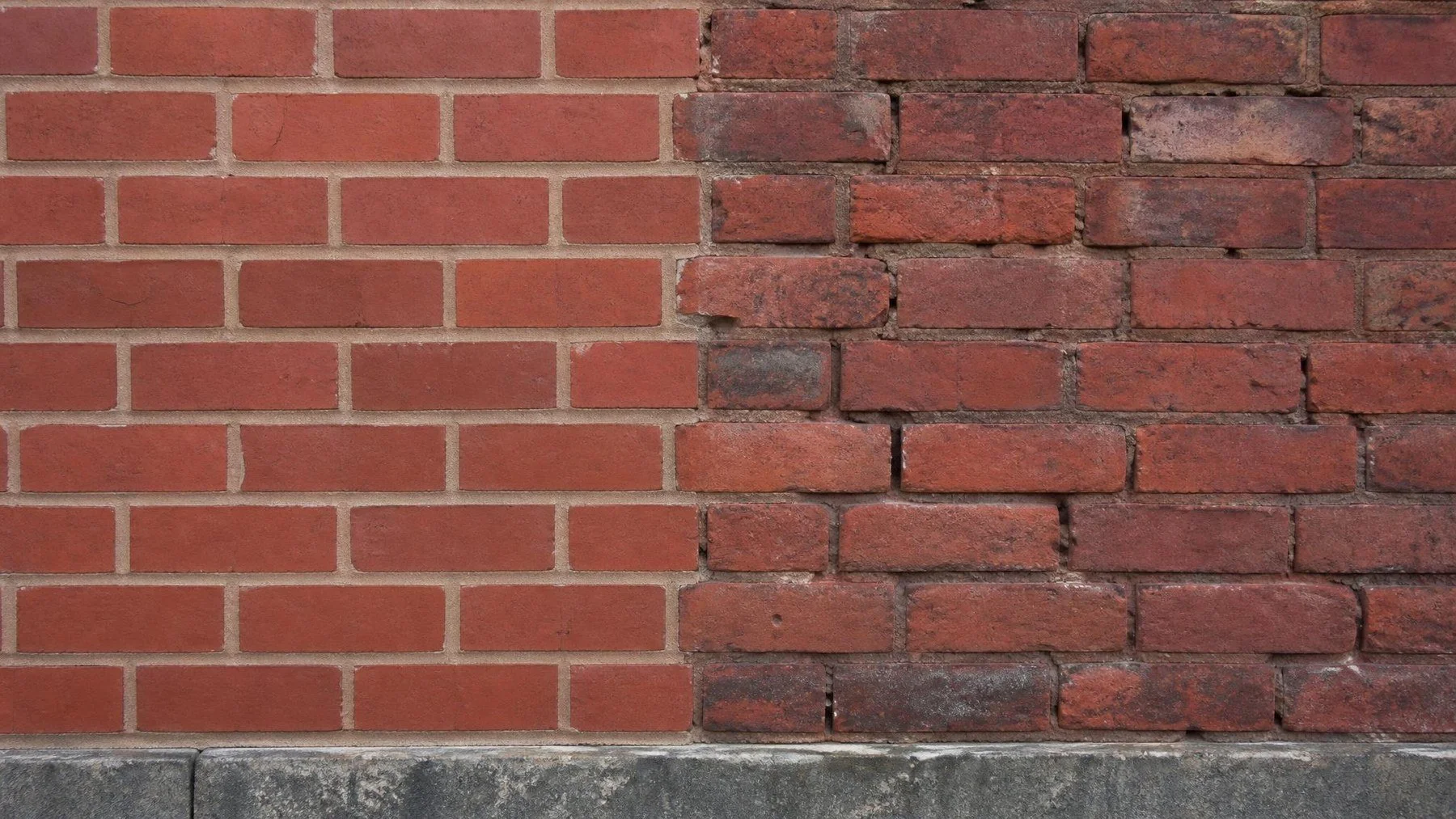 Brick wall showing freshly repointed joints beside older worn mortar