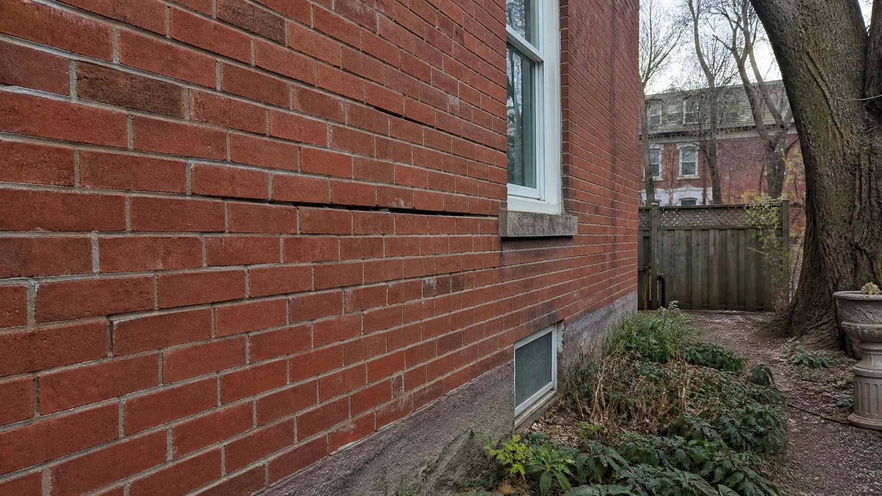 bulging brick wall assessment on brick masonry