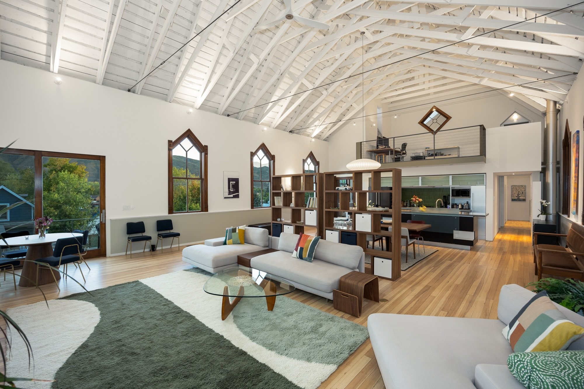 Sunrise coffee on the deck off the primary suite, a walk into town for dinner, and an office tucked into a steeple in between. This 1896 church in downtown Basalt has been reimagined into two independent residences: a three-bedroom main home under 26