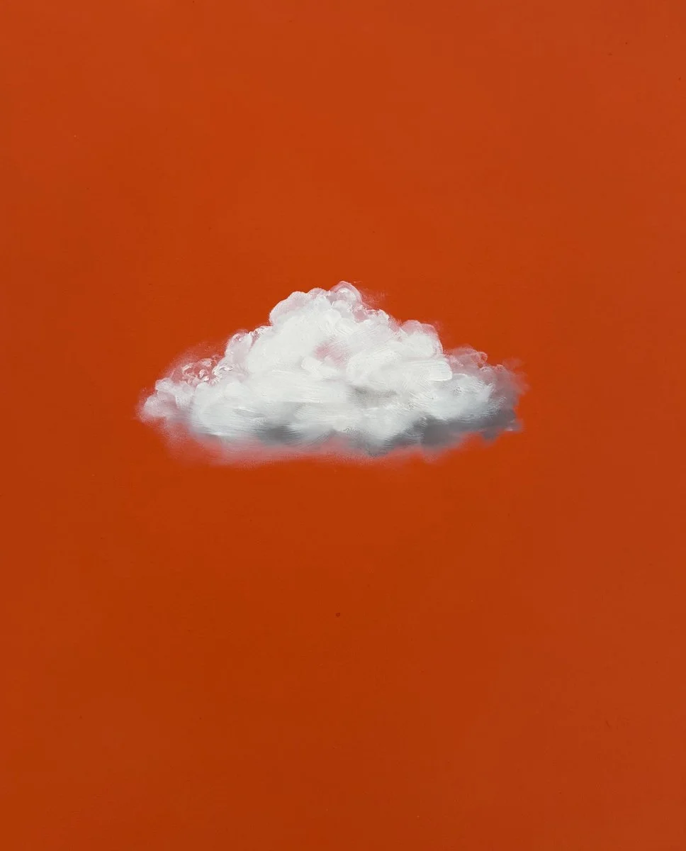 A white cloud against an orange background.