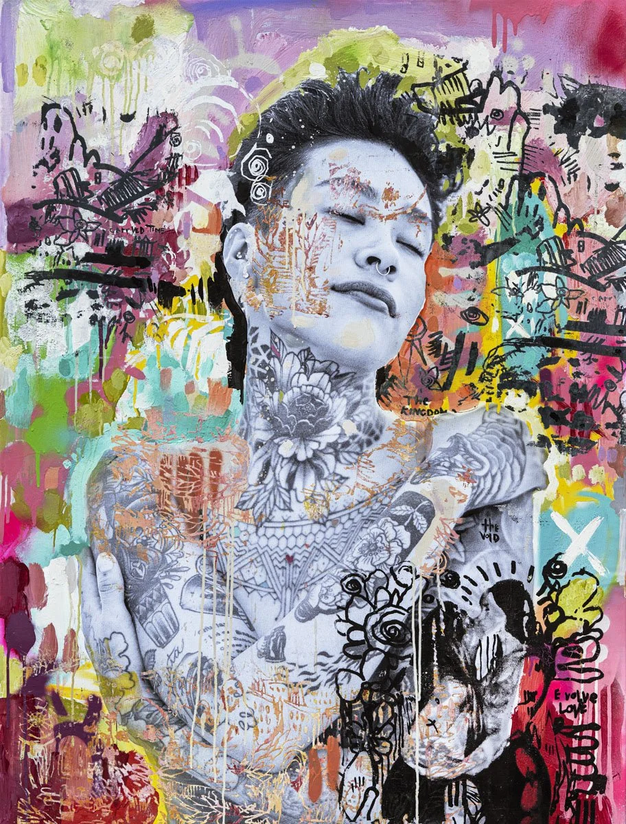 Street art mural of a black and white portrait of a woman with tattoos and closed eyes, surrounded by colorful graffiti, abstract patterns, and peace dove images.