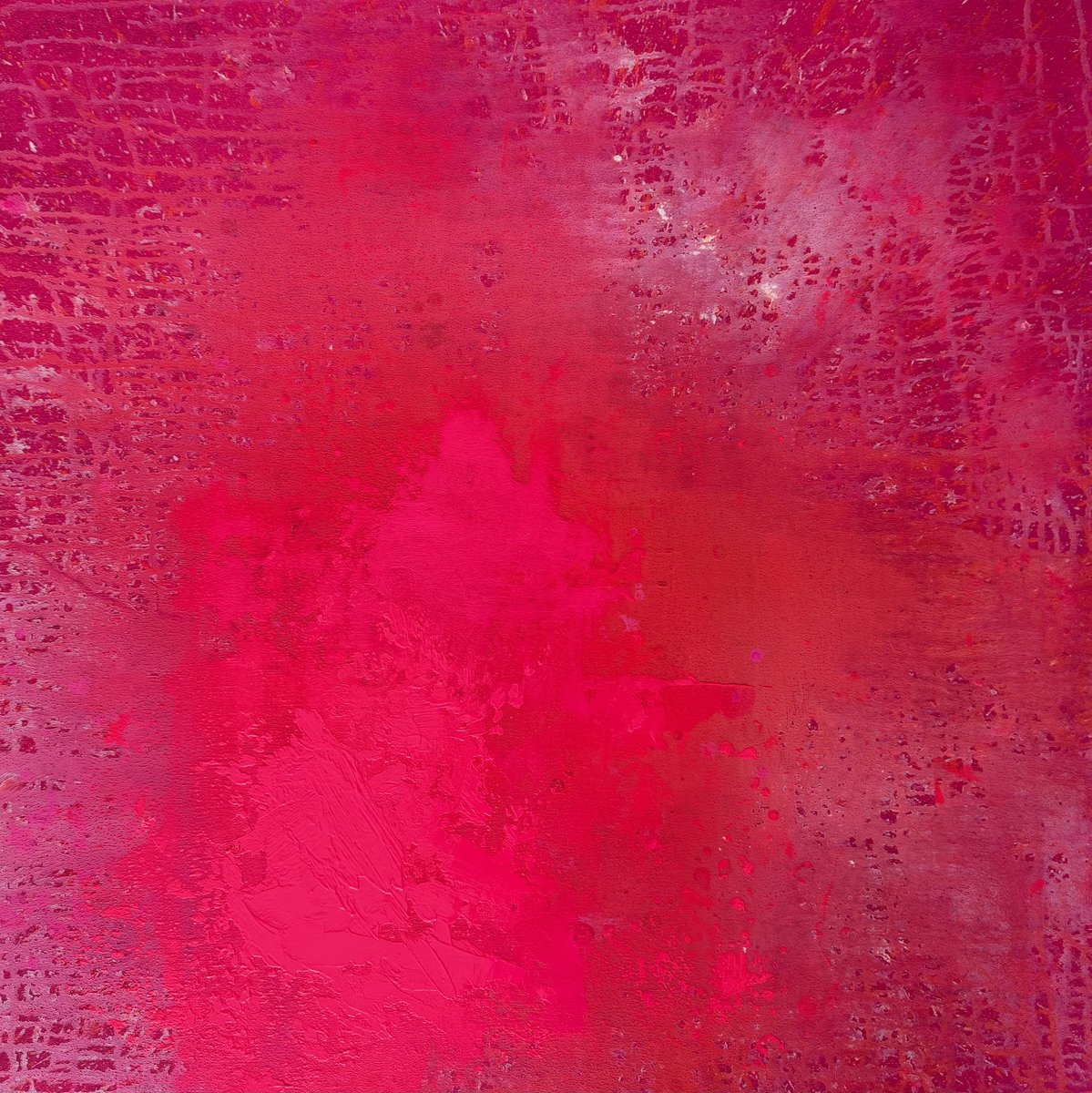Abstract textured pink and red background with varying shades and patterns.