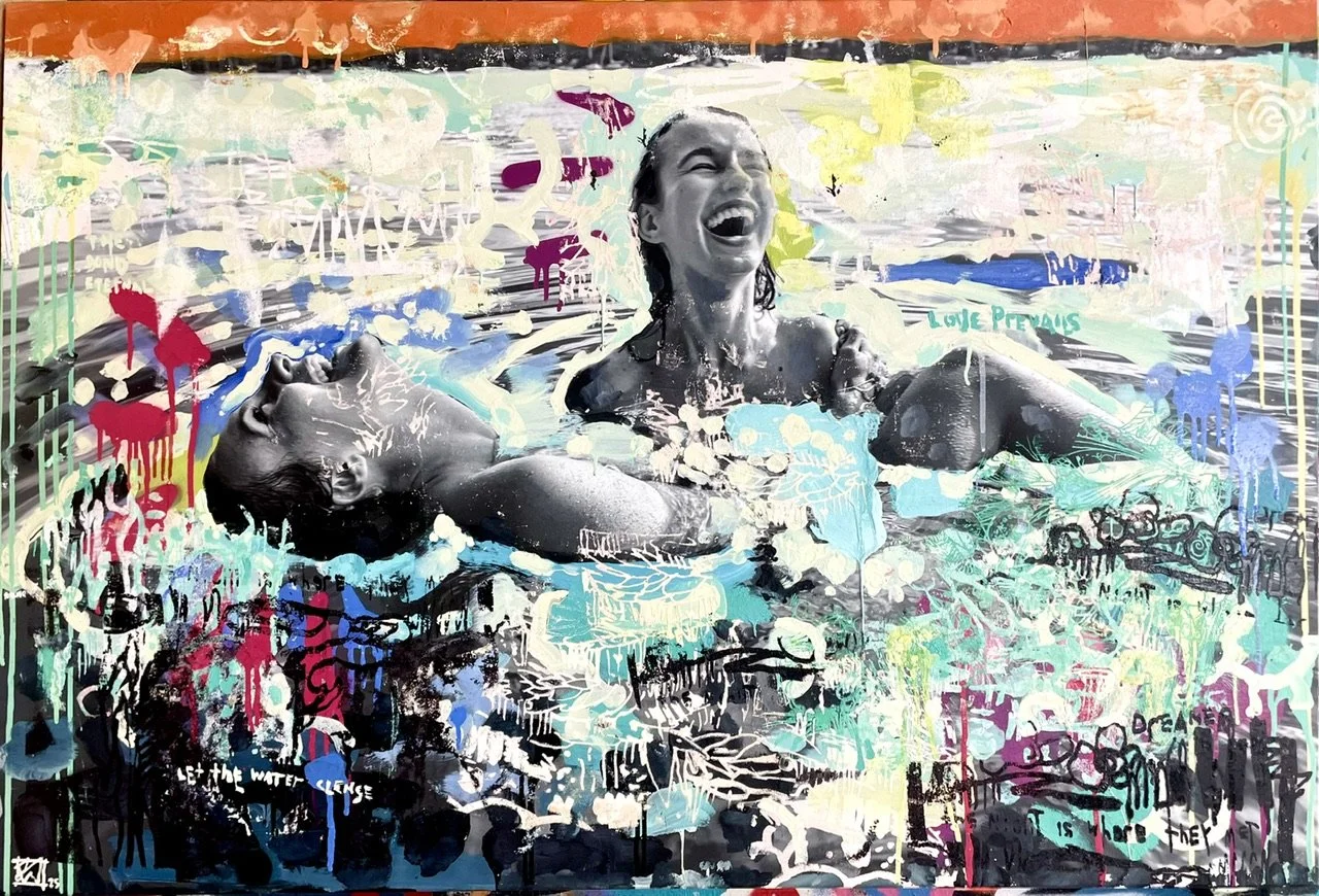 A woman laughing and smiling while floating and lying in a pool, surrounded by colorful abstract graffiti-style artwork and paint splatters.