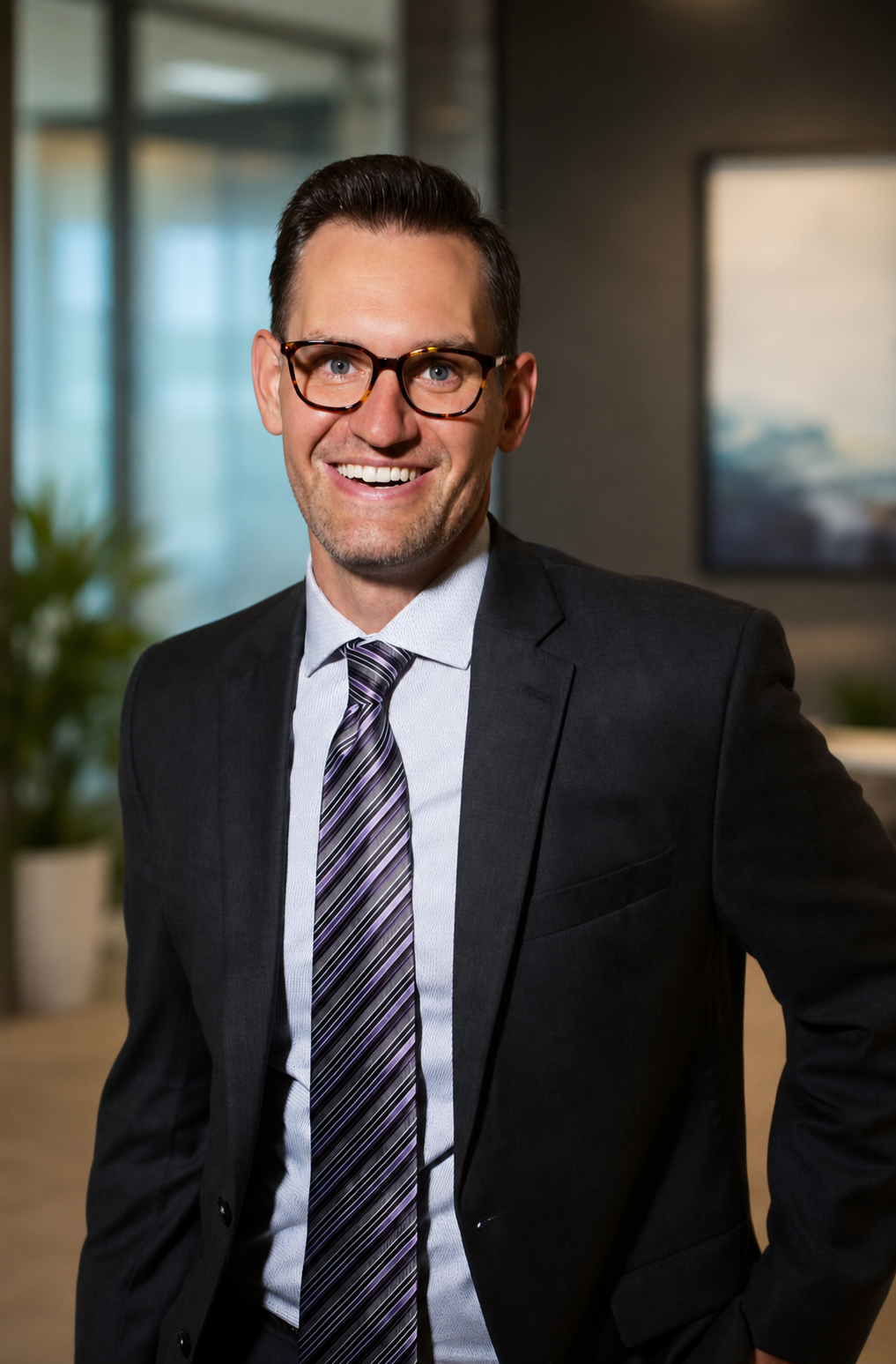 Spencer Fehrenbacher, SpeakEasy Founder and Coach, smiling in an office setting.