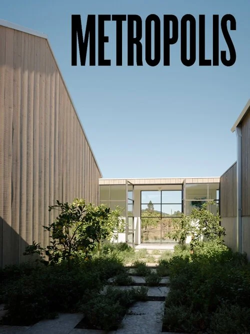 Modern courtyard with pathway and greenery, surrounded by minimalist buildings, and the word 'METROPOLIS' at the top.