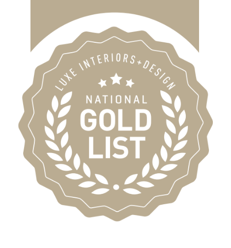 Gold list badge with laurel leaves, stars, and text indicating luxury interiors and design.