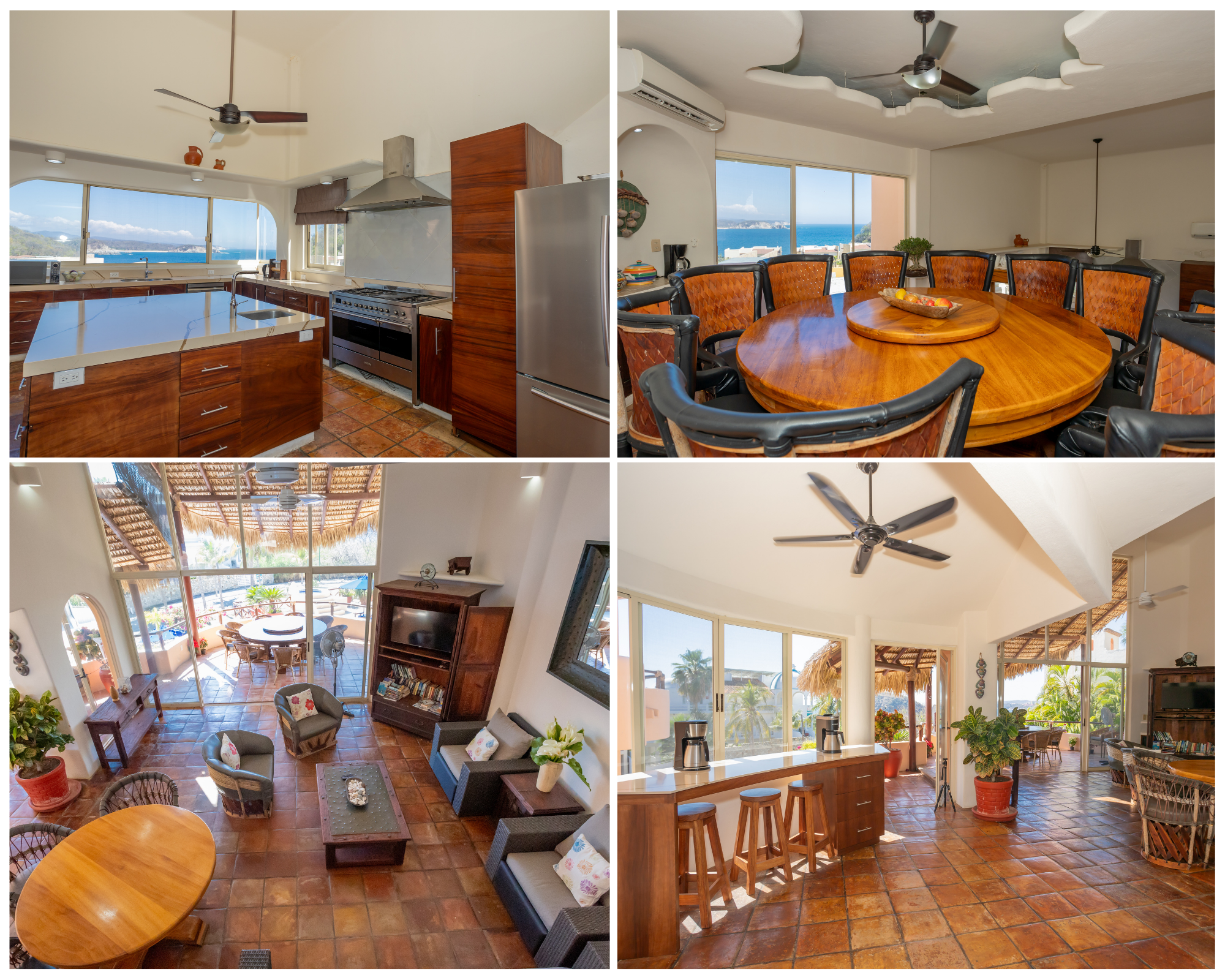 Interior view of a coastal home showcasing a kitchen on the left with wooden cabinetry, a large window with a sea view, and a refrigerator. On the right is a dining area with a round wooden table, upholstered chairs, a ceiling with decorative moldings and fans, and large windows with ocean views.