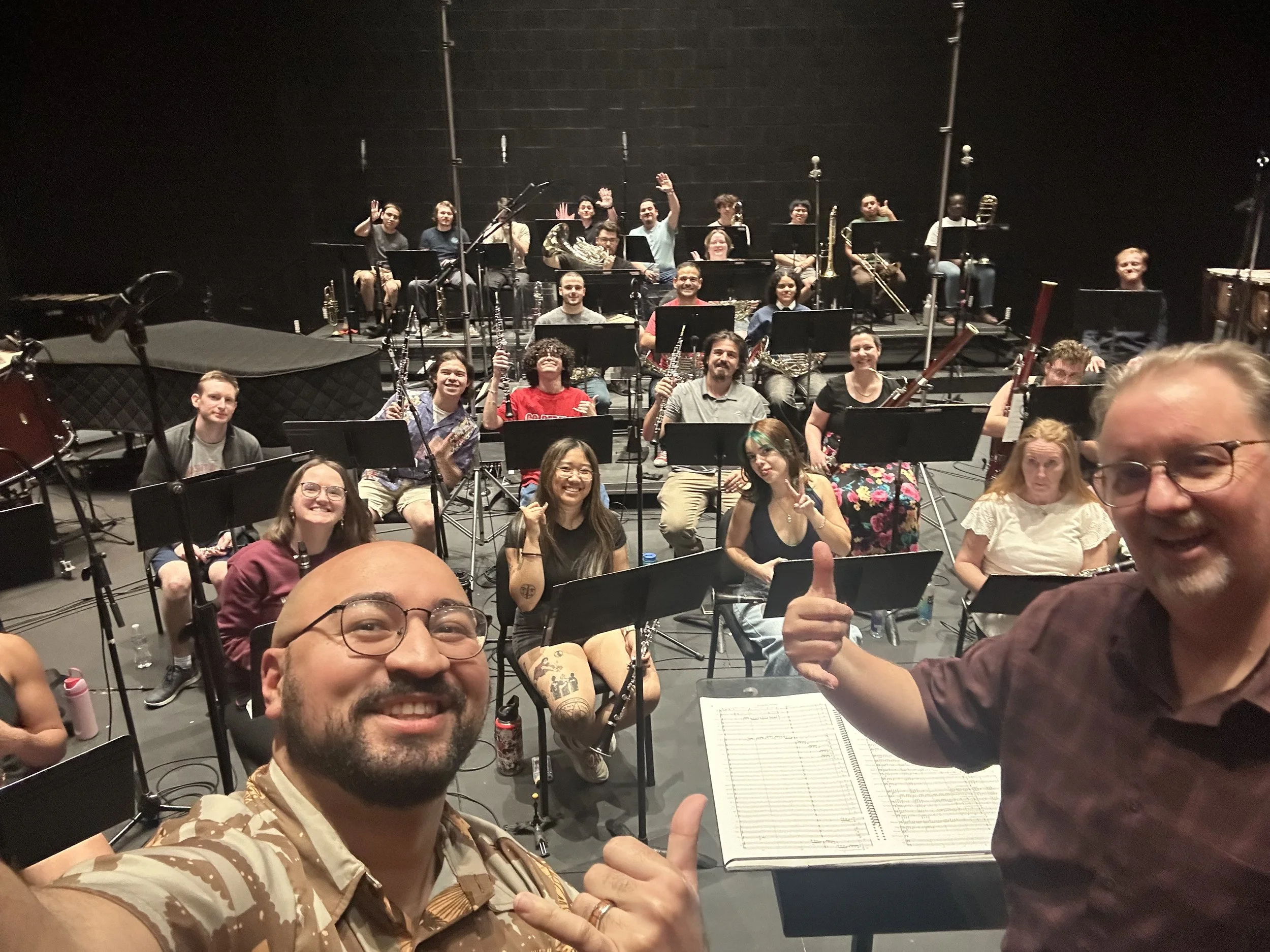 Dr. Ocean Akaka taking a selfie with members of the UNLV Wind Orchestra, after a recording session of his transcription, "Kealaikahiki".