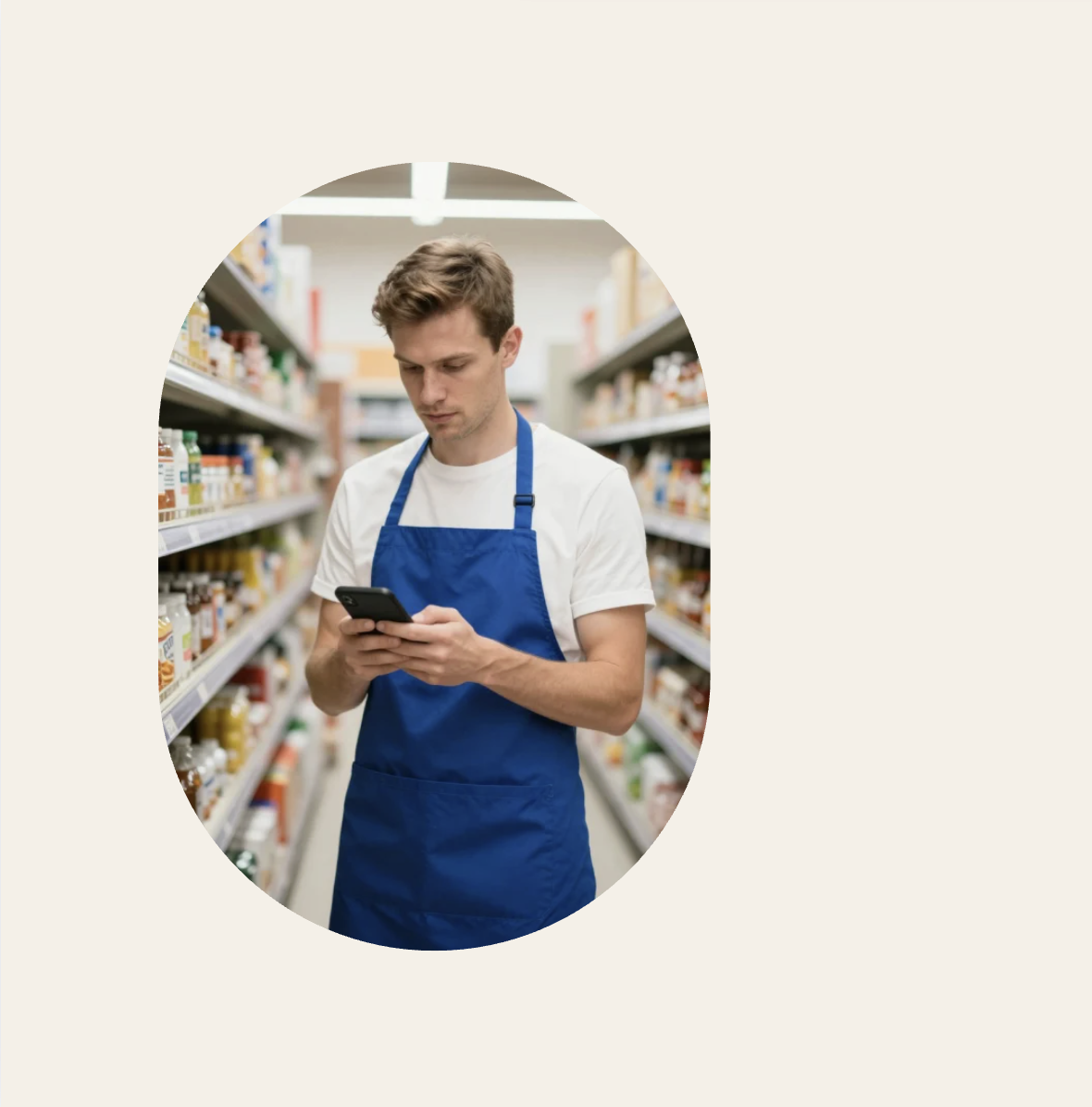 person with blue apron typing on a mobile device