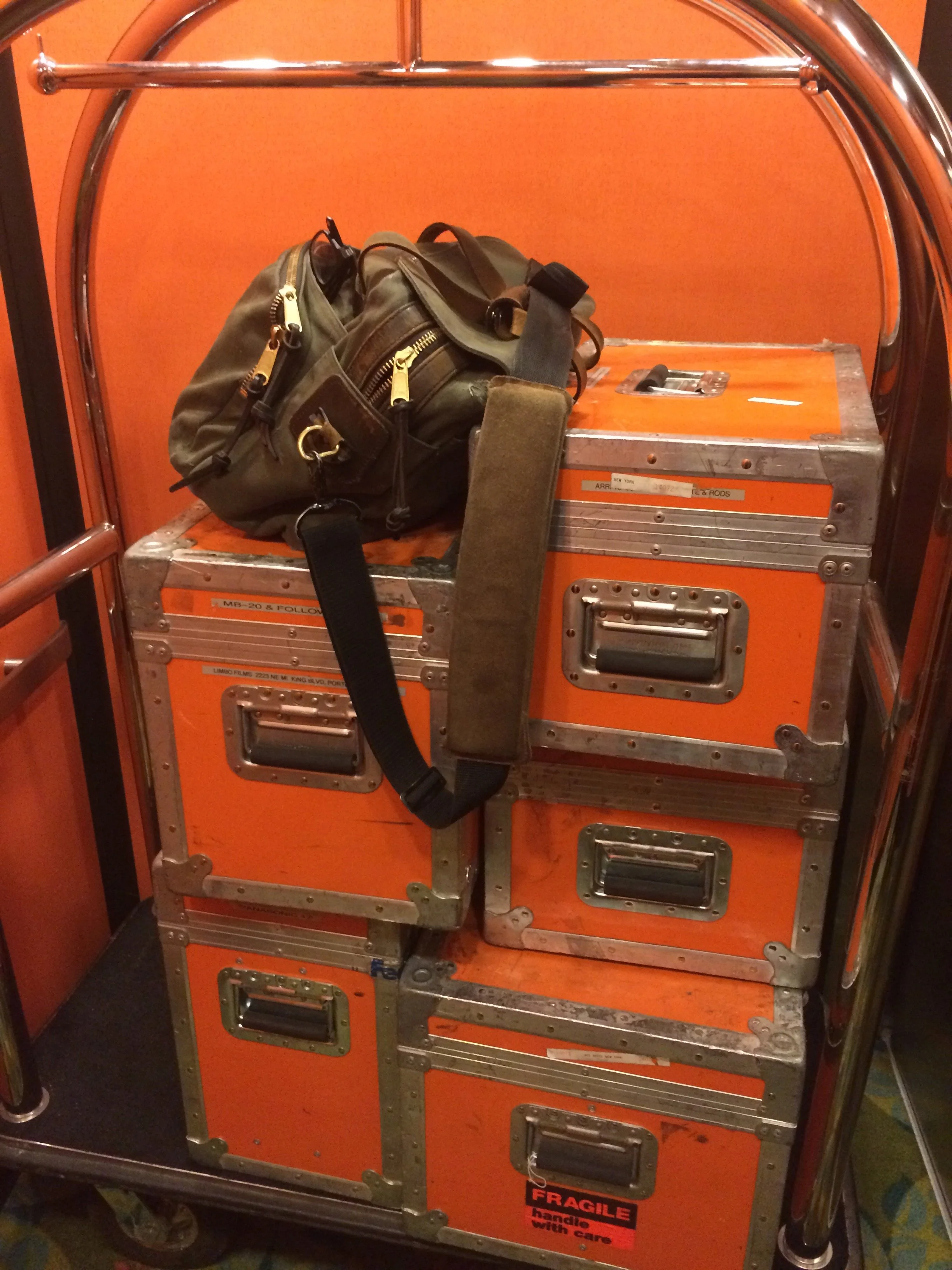 we have a collection of these, my camera gear in it's happy orange cases, on the bell cart we borrowed. Usually at check in to a wide assortment of Hotels and Motels all across the U.S.